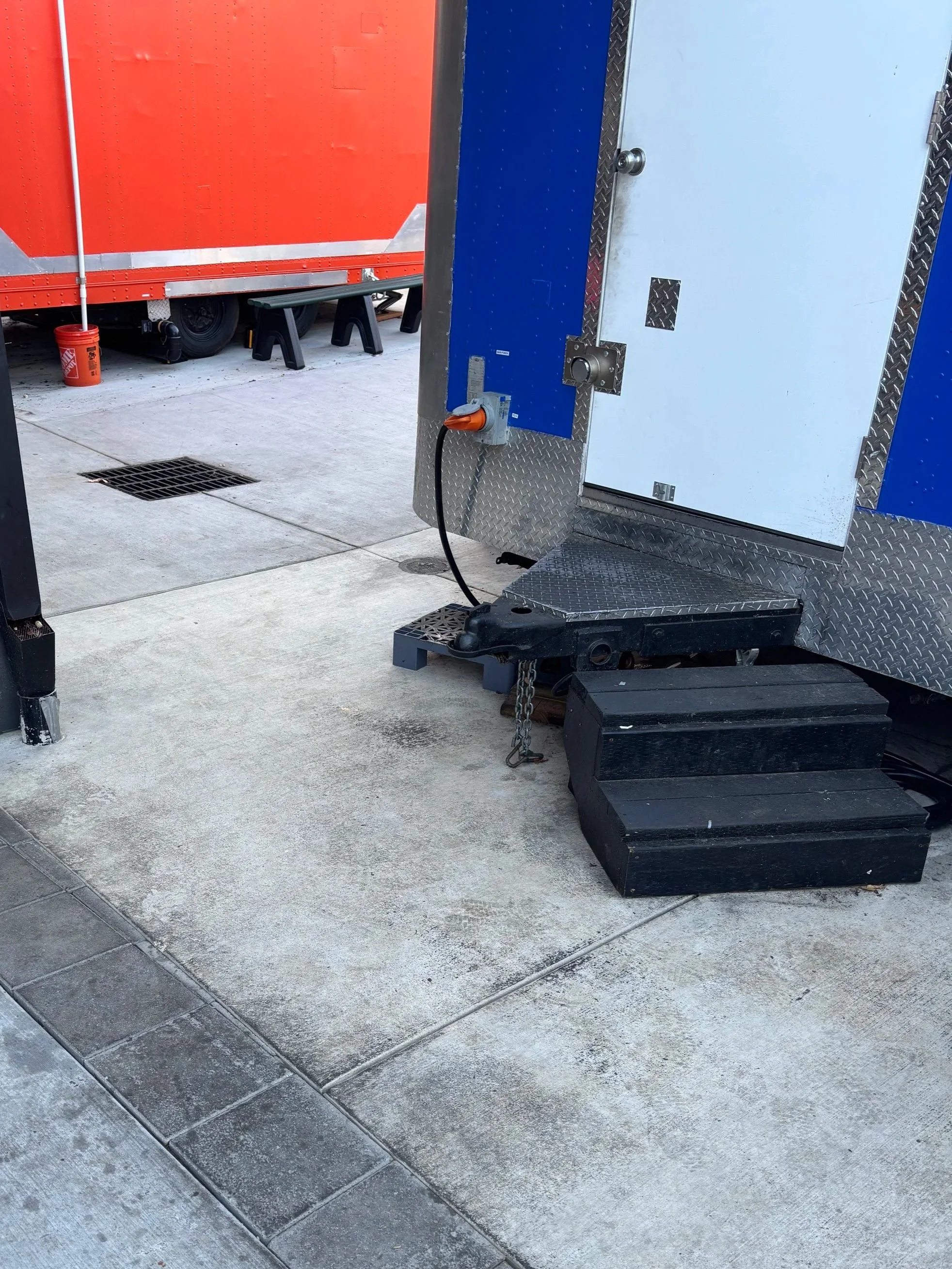 Grease behind food cart after degreaser and high volume rinse, Portland.