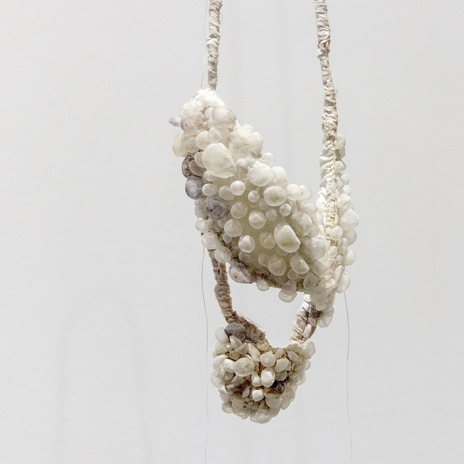 holding air necklace, 2026 . silk, cotton.