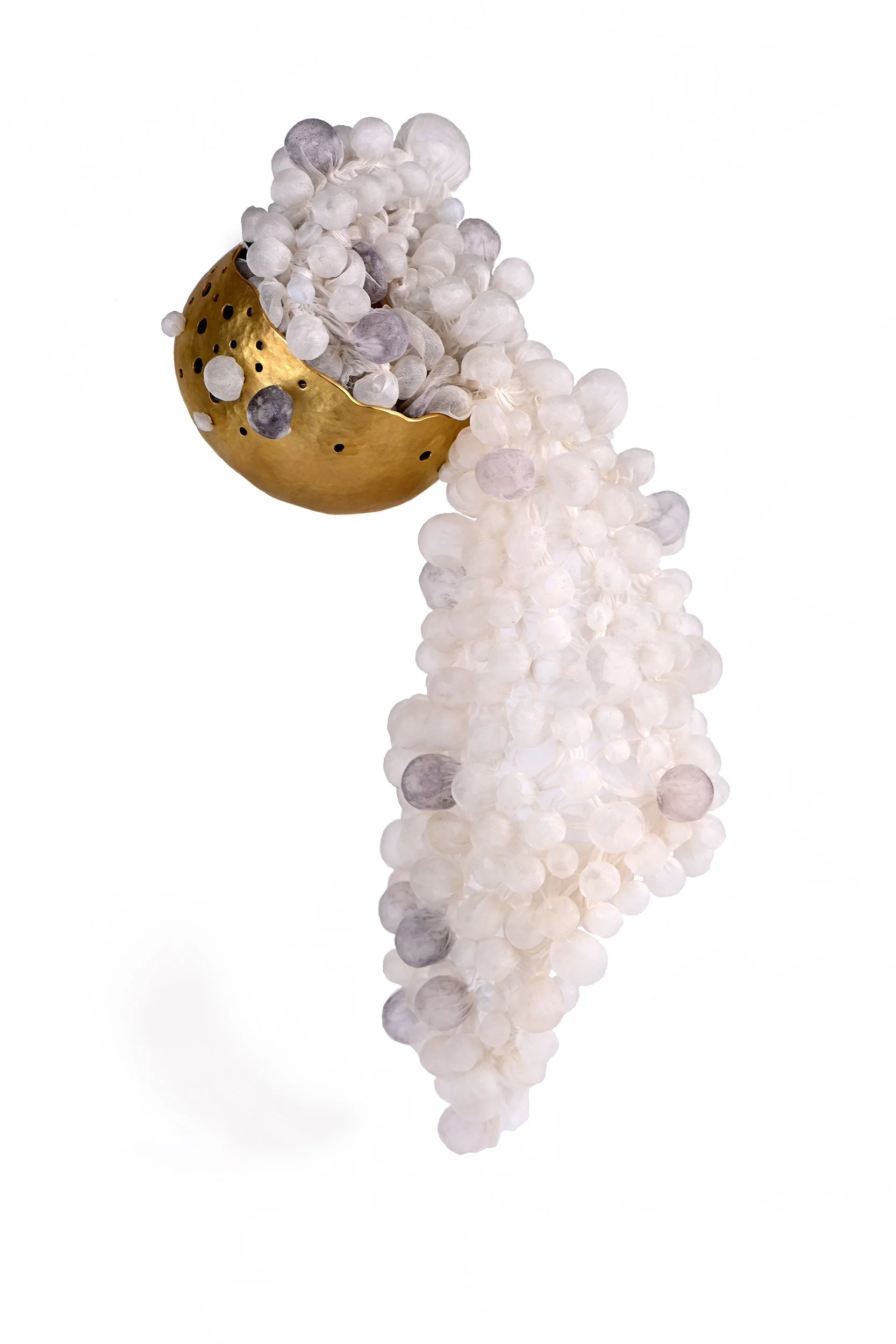 holding air: small vessel. silk, brass.
