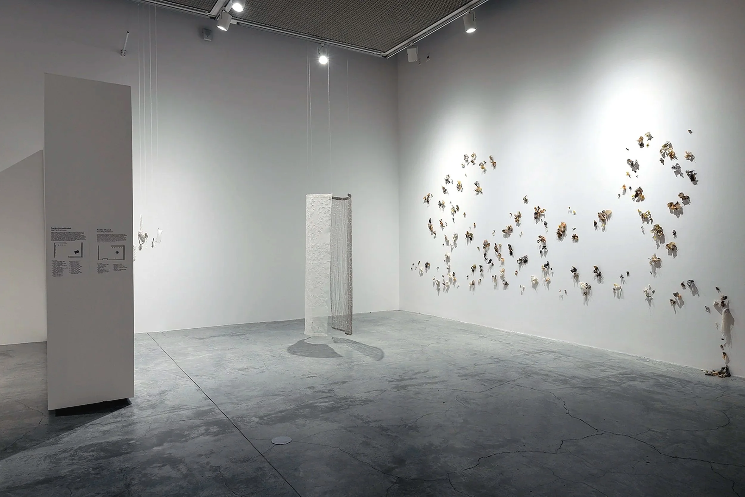 touching absence, 2026. linen, wax, metal, pins.