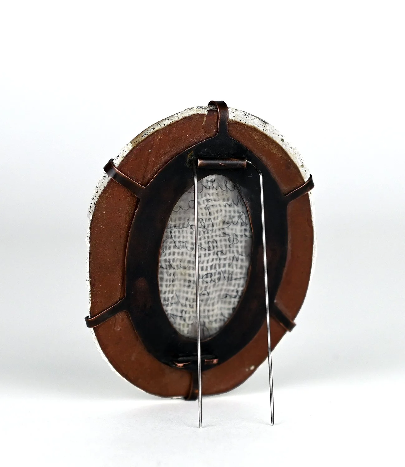 marks of absence, 2024. clay, copper, vellum, cloth, steel.