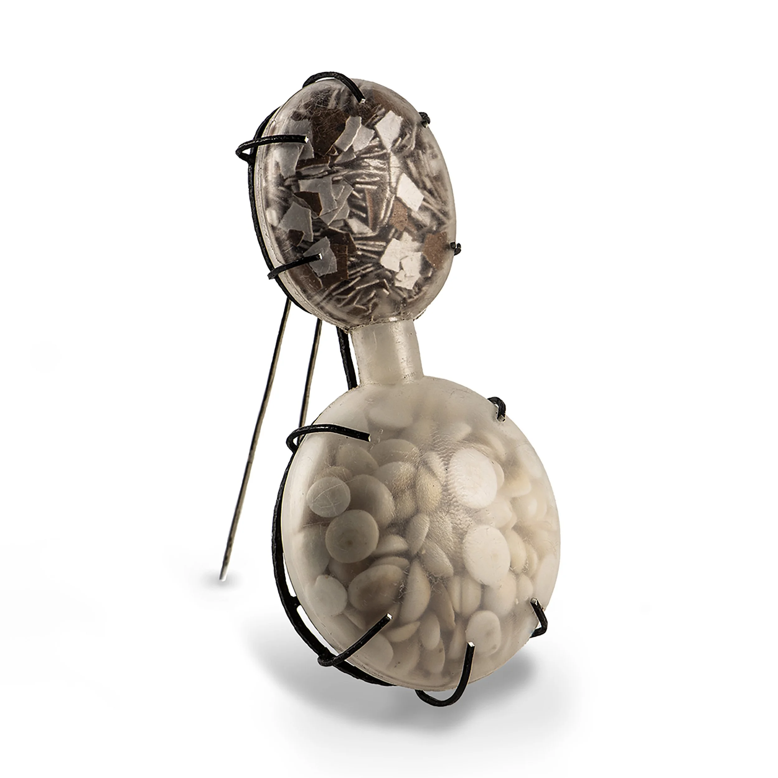 balance, 2024. squeaker, egg shells, pebbles, silver, steel.