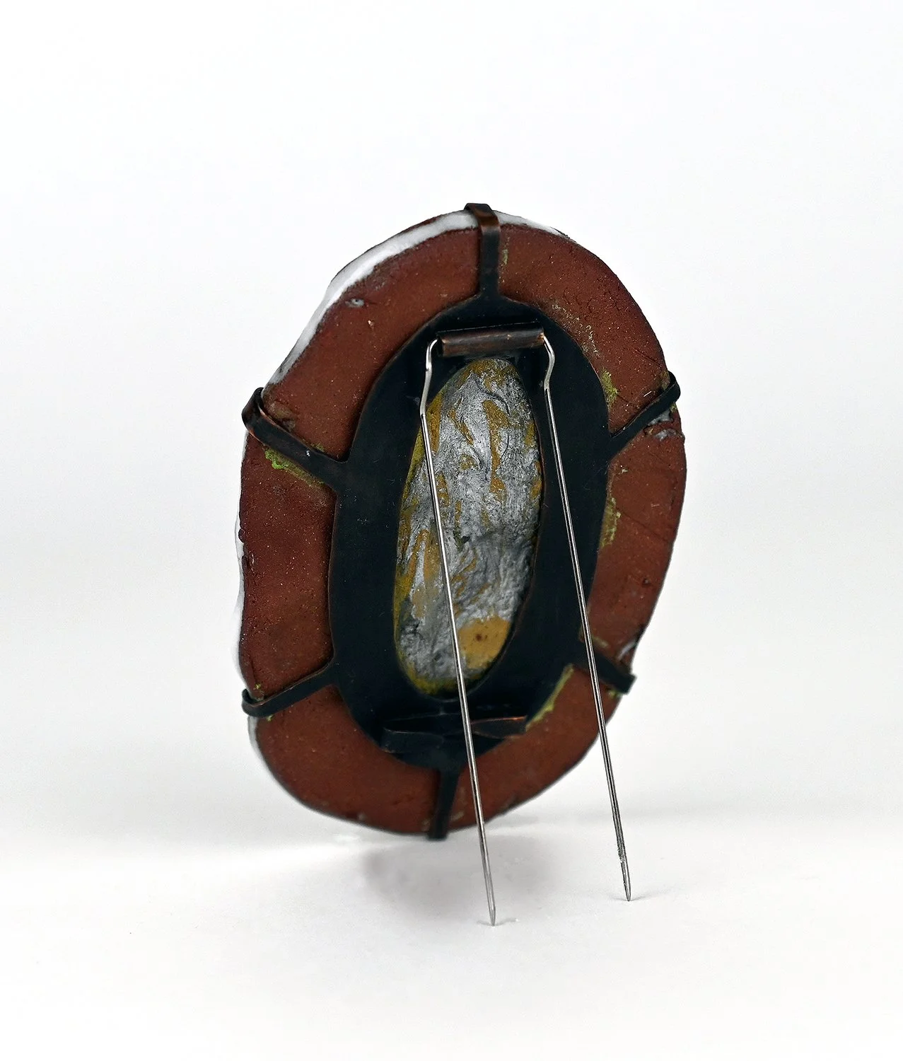 traces, 2024. clay, copper, acrylic paint, moonstone sand, steel.