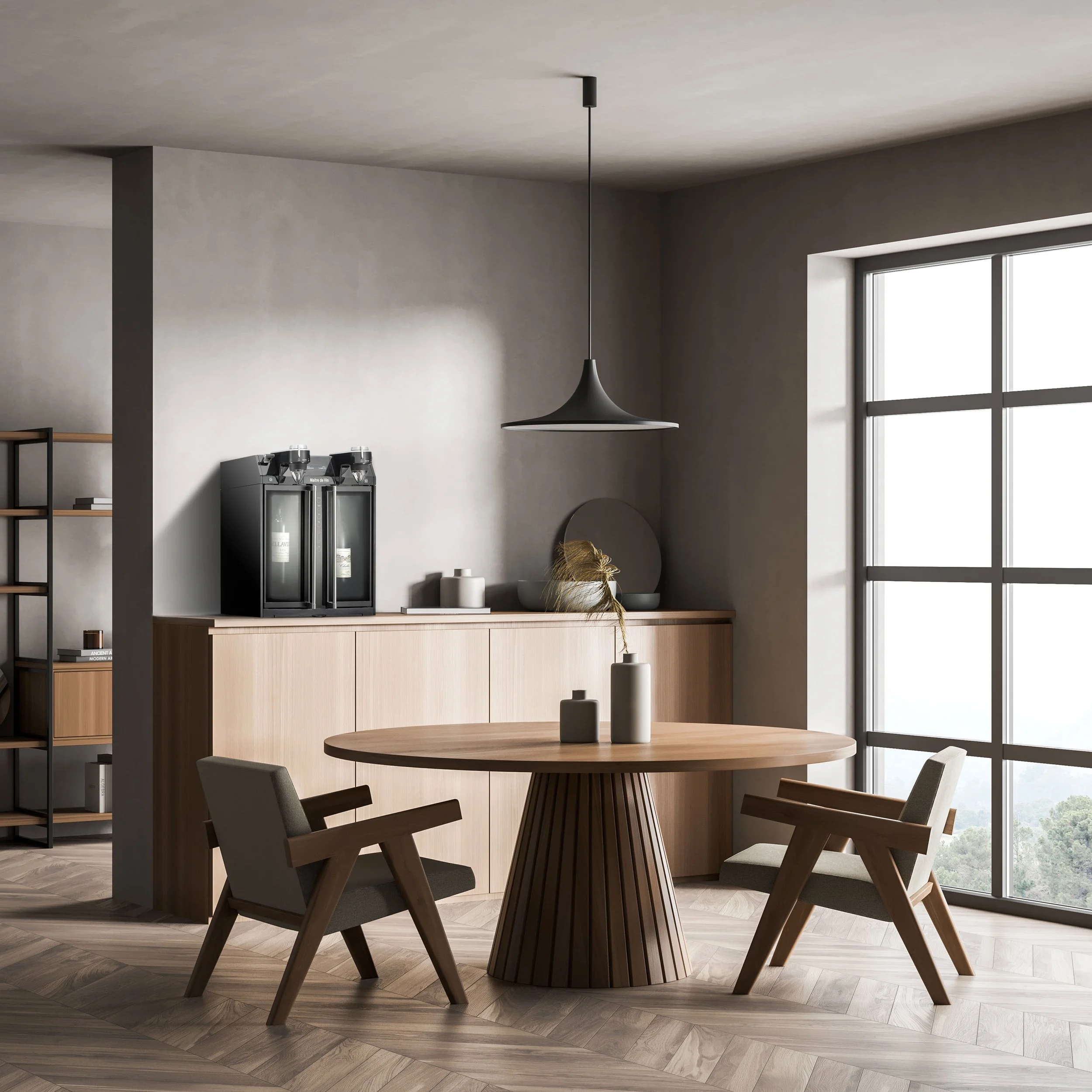 Modern minimalistic dining area with a round wooden table, four matching chairs, decorative vases, and large windows allowing natural light, in a room with light-colored walls and herringbone wood flooring.