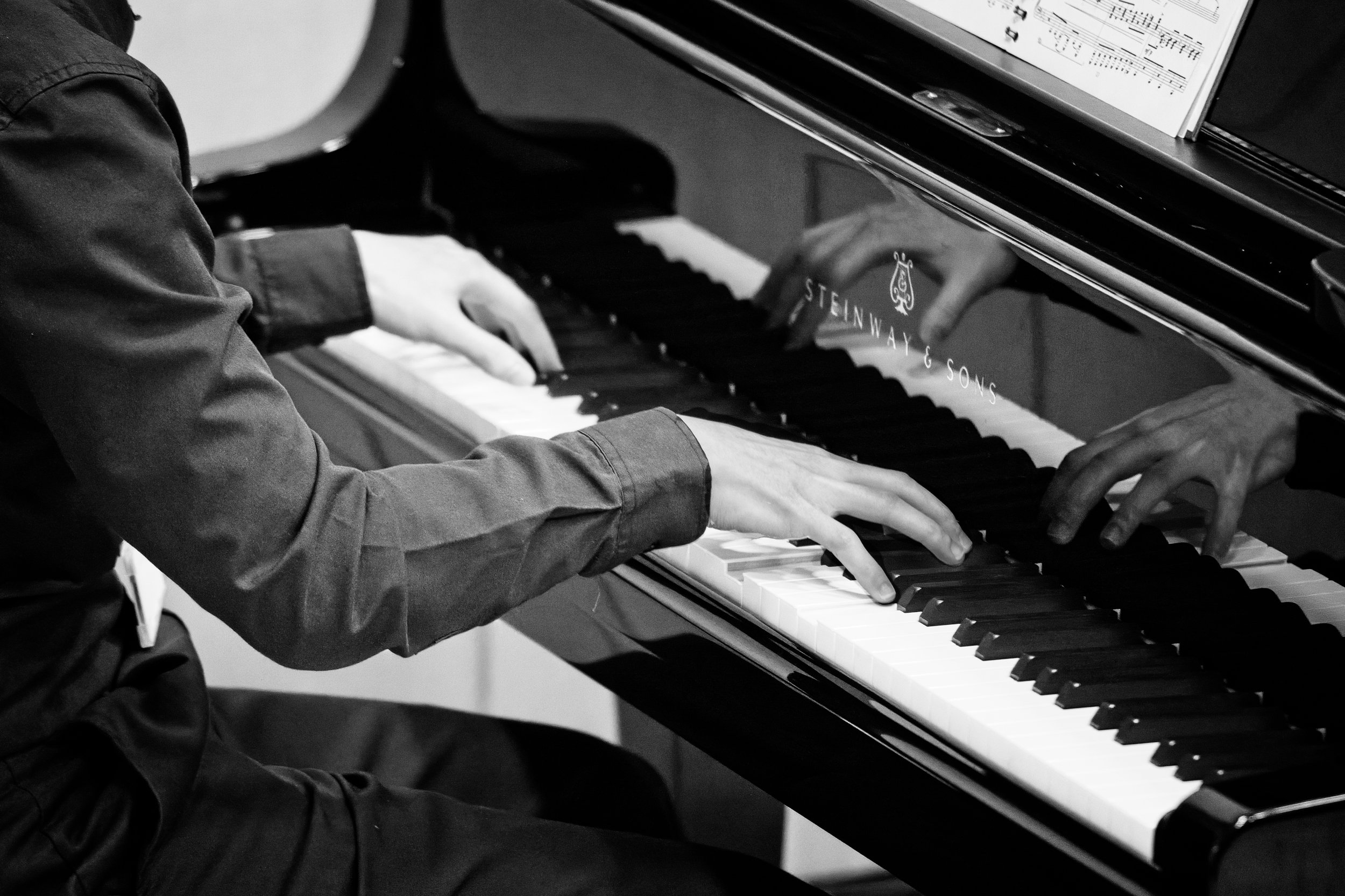 High school student playing piano for a concert