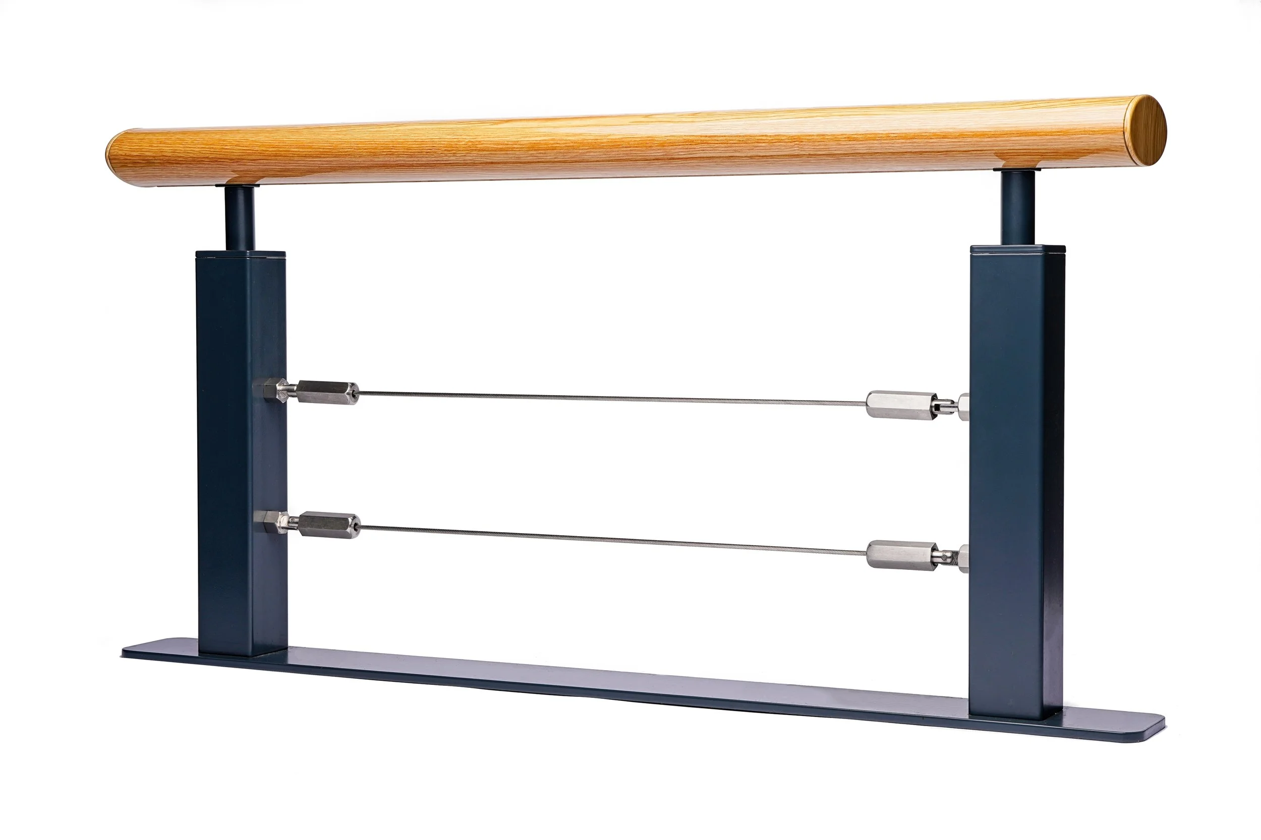 A ballet barre with a wooden top, black metal supports, and two metal bars connected by adjustable tension cables. Product photography Warwickshire.