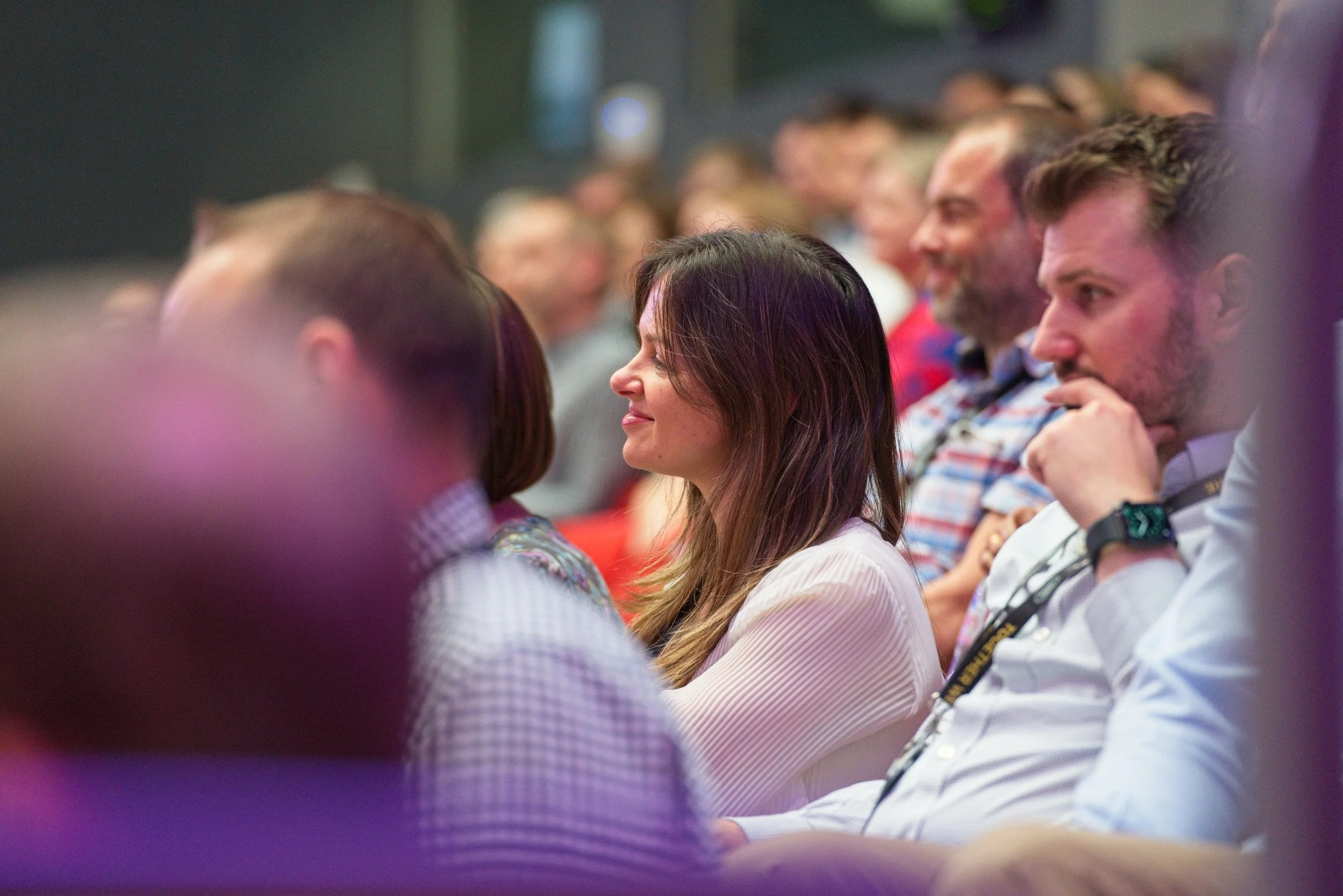 Audience of diverse adults seated and listening at a conference or seminar. Event Photography by photographer based in Southam, Warwickshire.