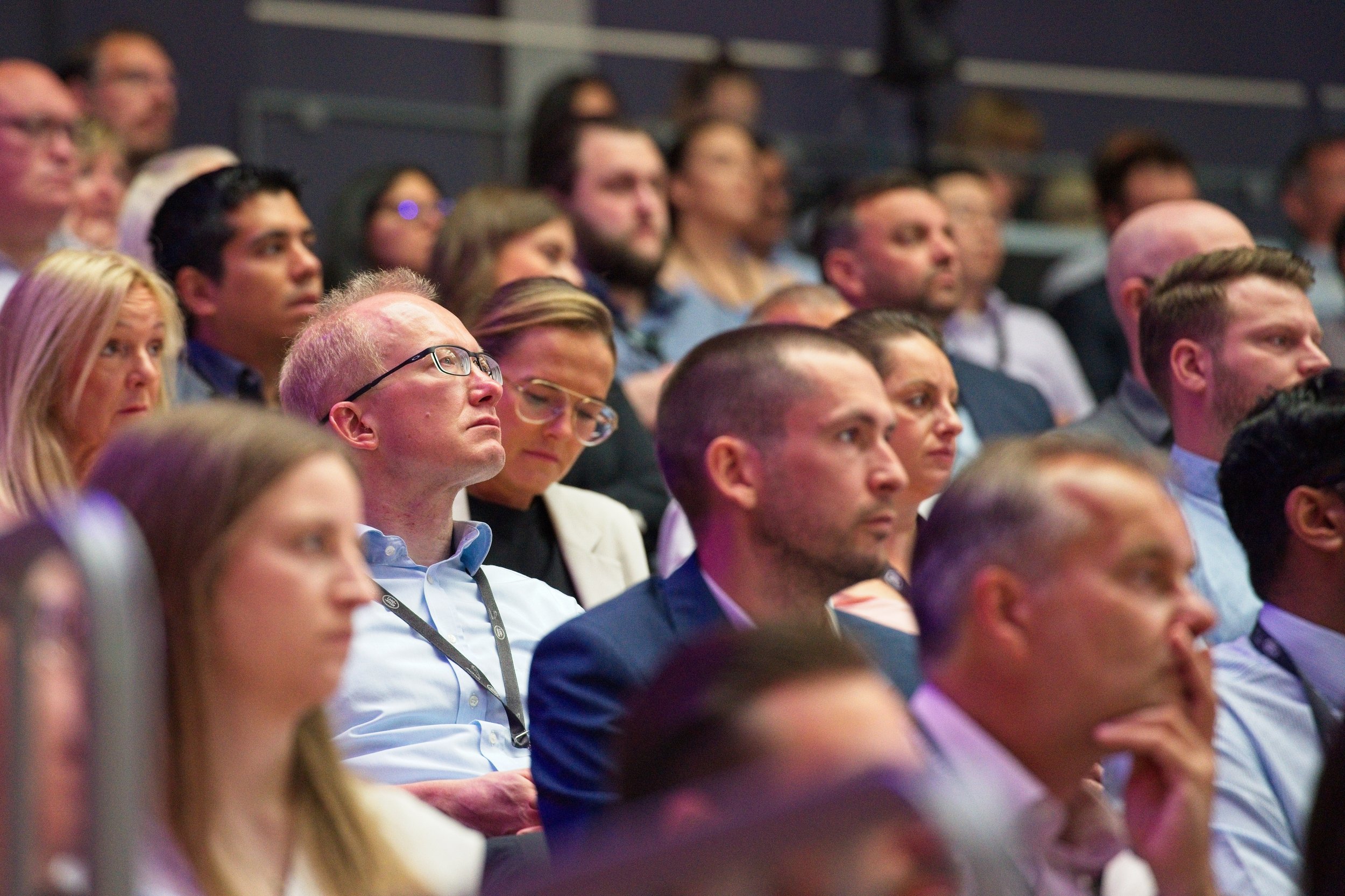 A diverse audience attending a conference or seminar listening to a speaker. Event Photography by photographer based in Southam, Warwickshire.