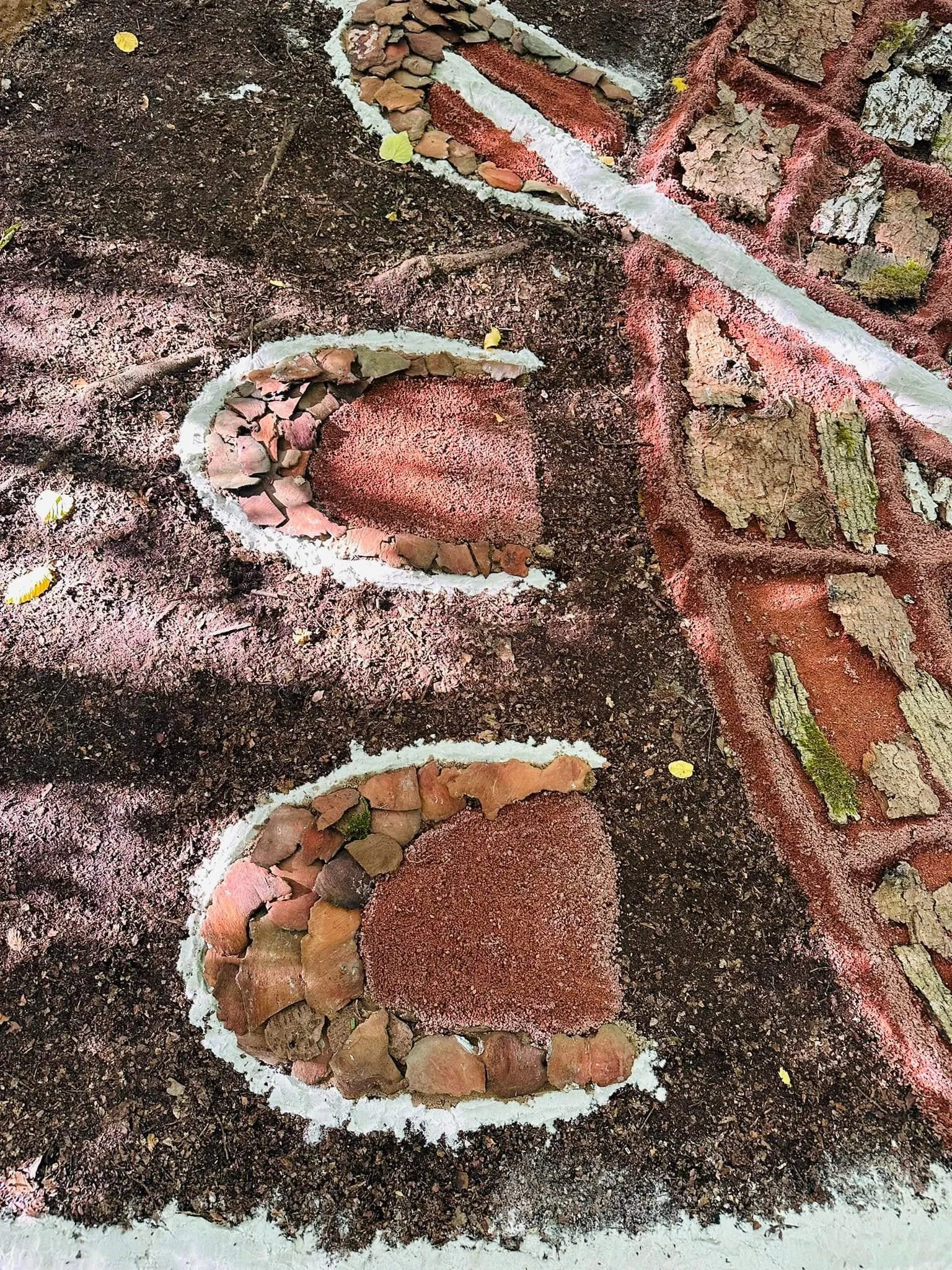 Close-up of a ground section with colorful calcite deposits highlighting mineral formations.