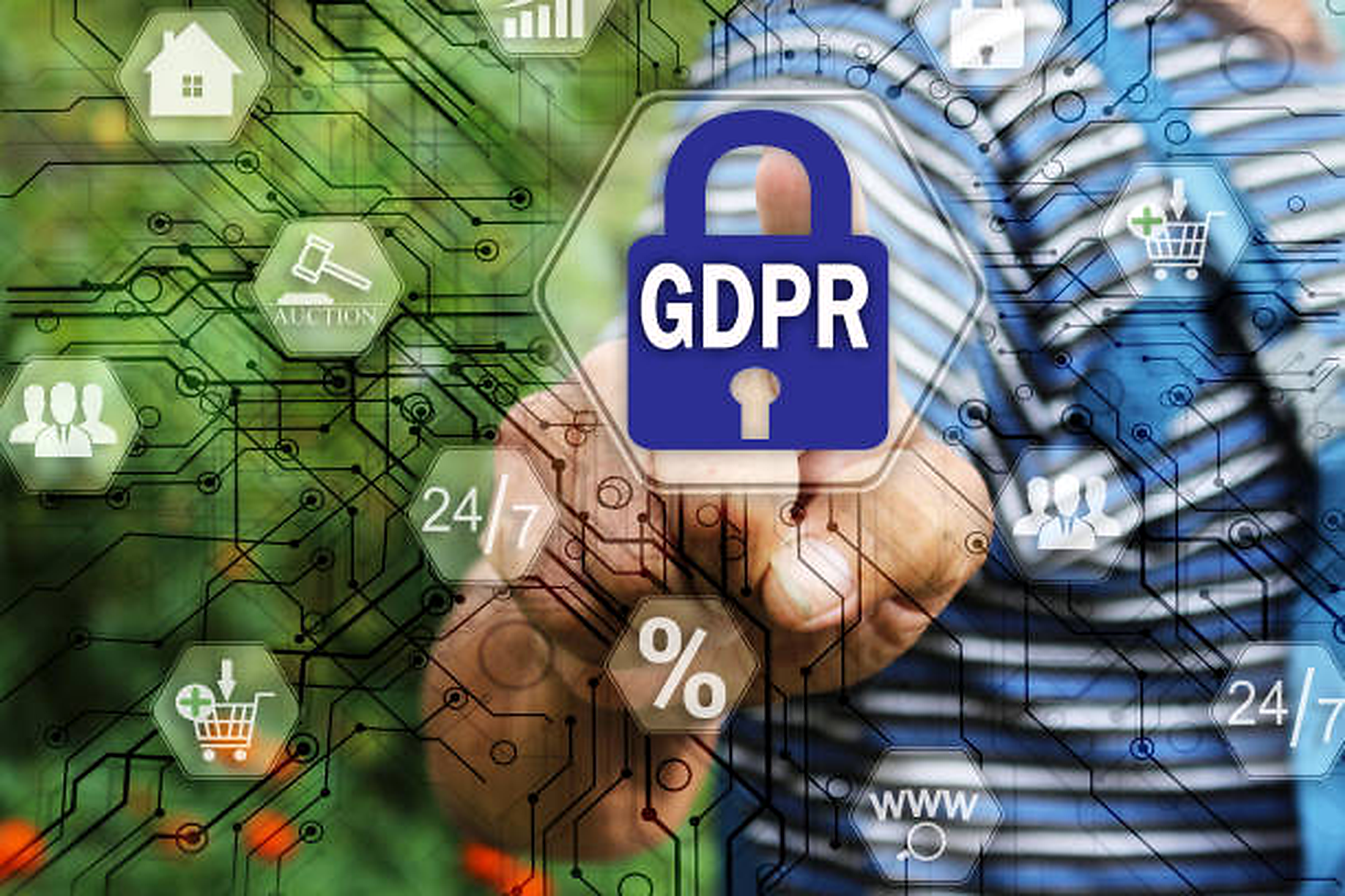 Hand holding a blue lock icon with 'GDPR' text surrounded by digital icons representing technology, shopping, and communication.