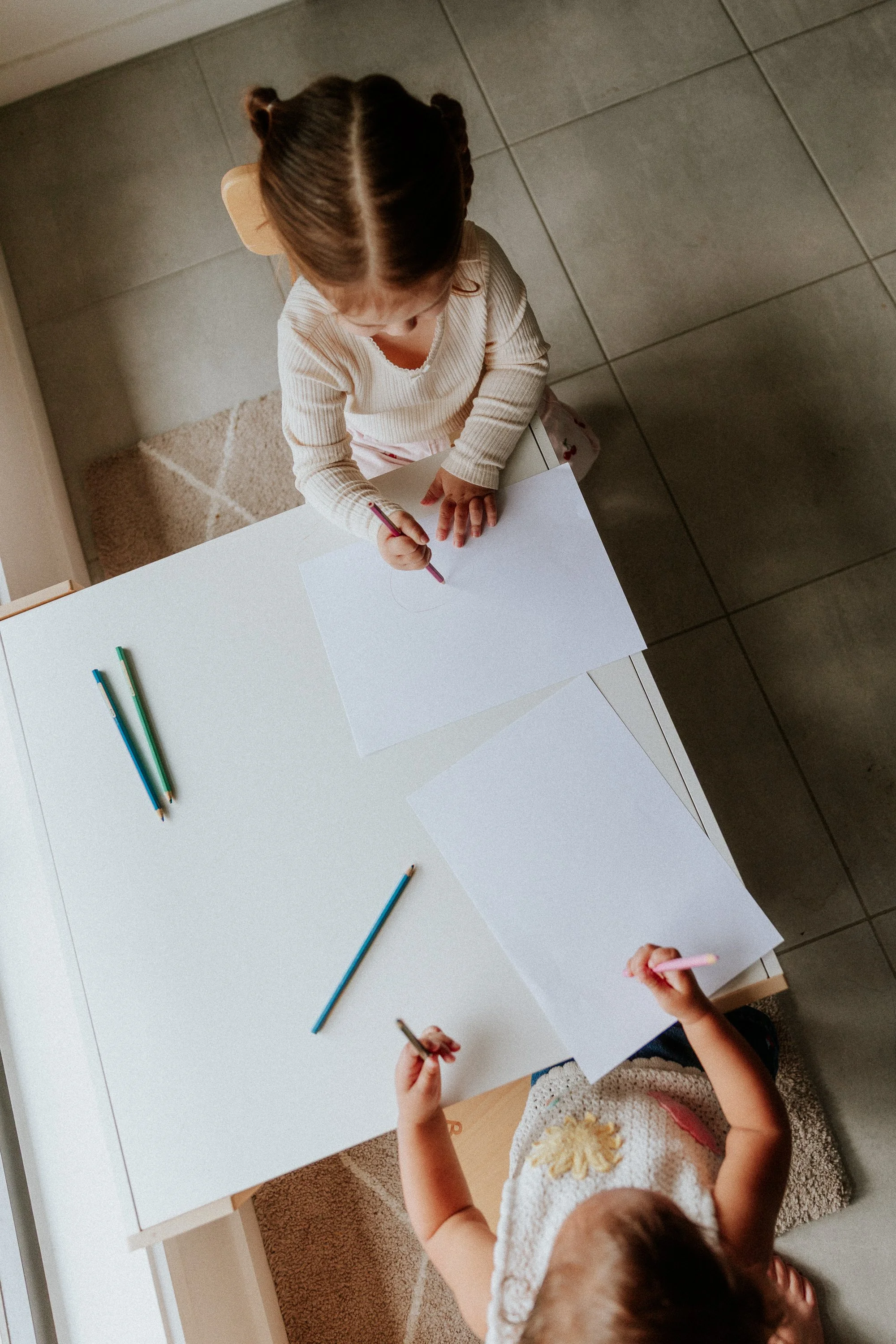 Children drawing at a table