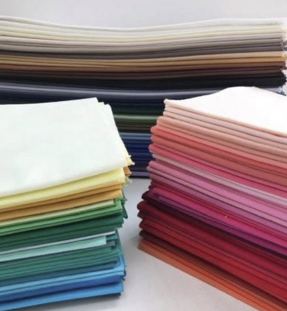 Stack of colorful swatches in various colors.