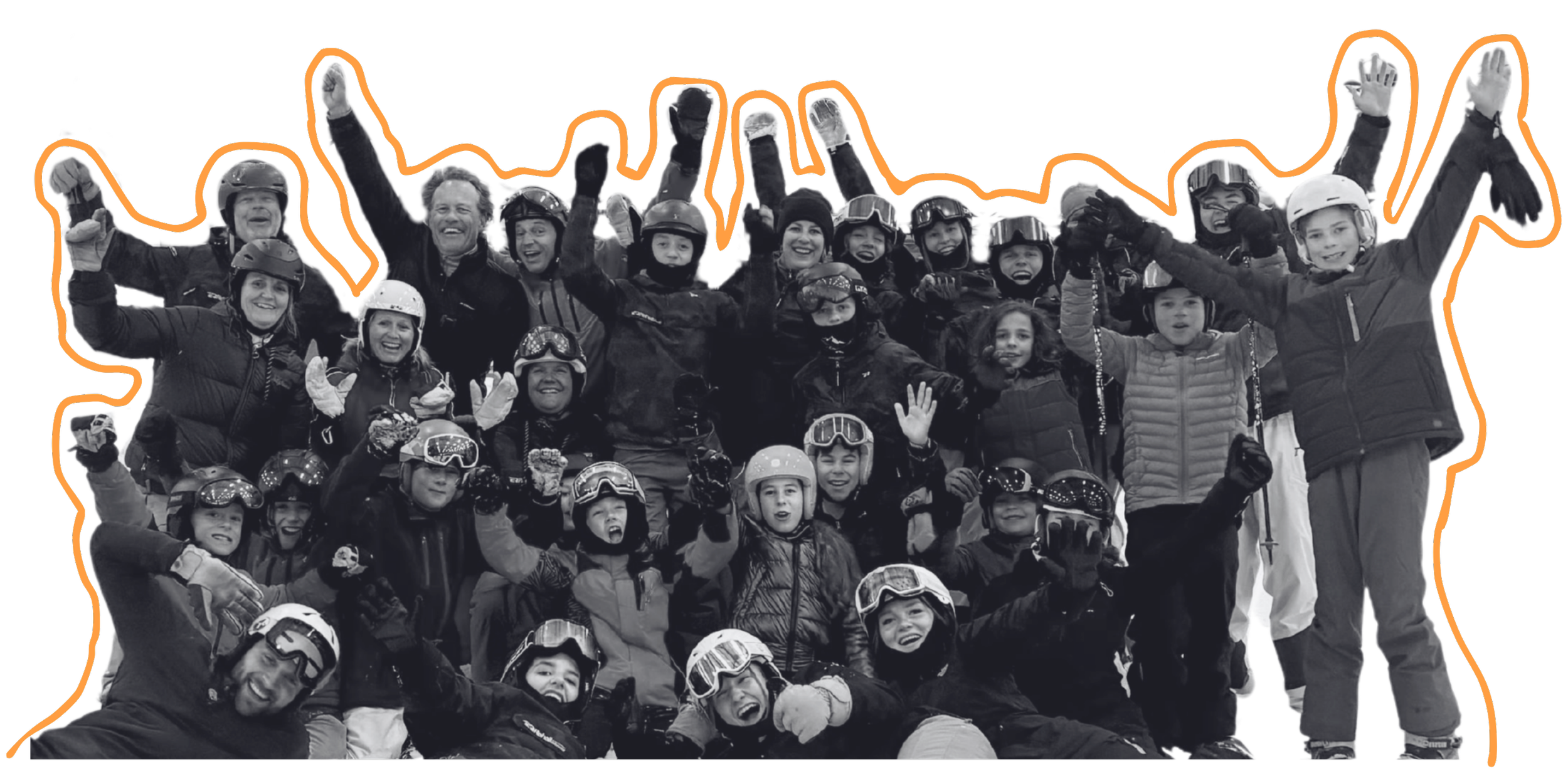 Group of children and adults in winter gear, celebrating outdoors, with some wearing helmets and goggles, smiling, raising their hands, in a snowy environment.
