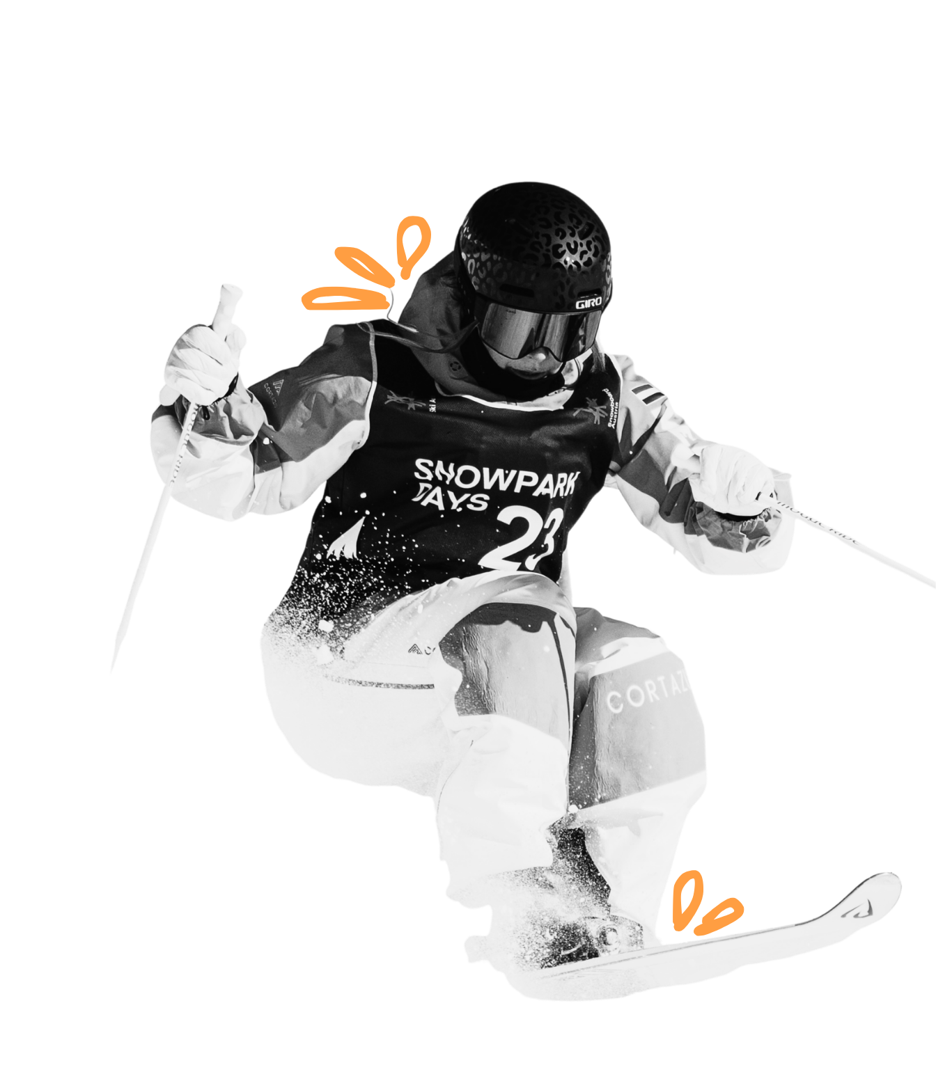 Black and white photo of a skier in mid-air during a jump, wearing a helmet, goggles, and sports gear with 'SNOWPARK DAYS' on the chest, and snow spraying from the skis.