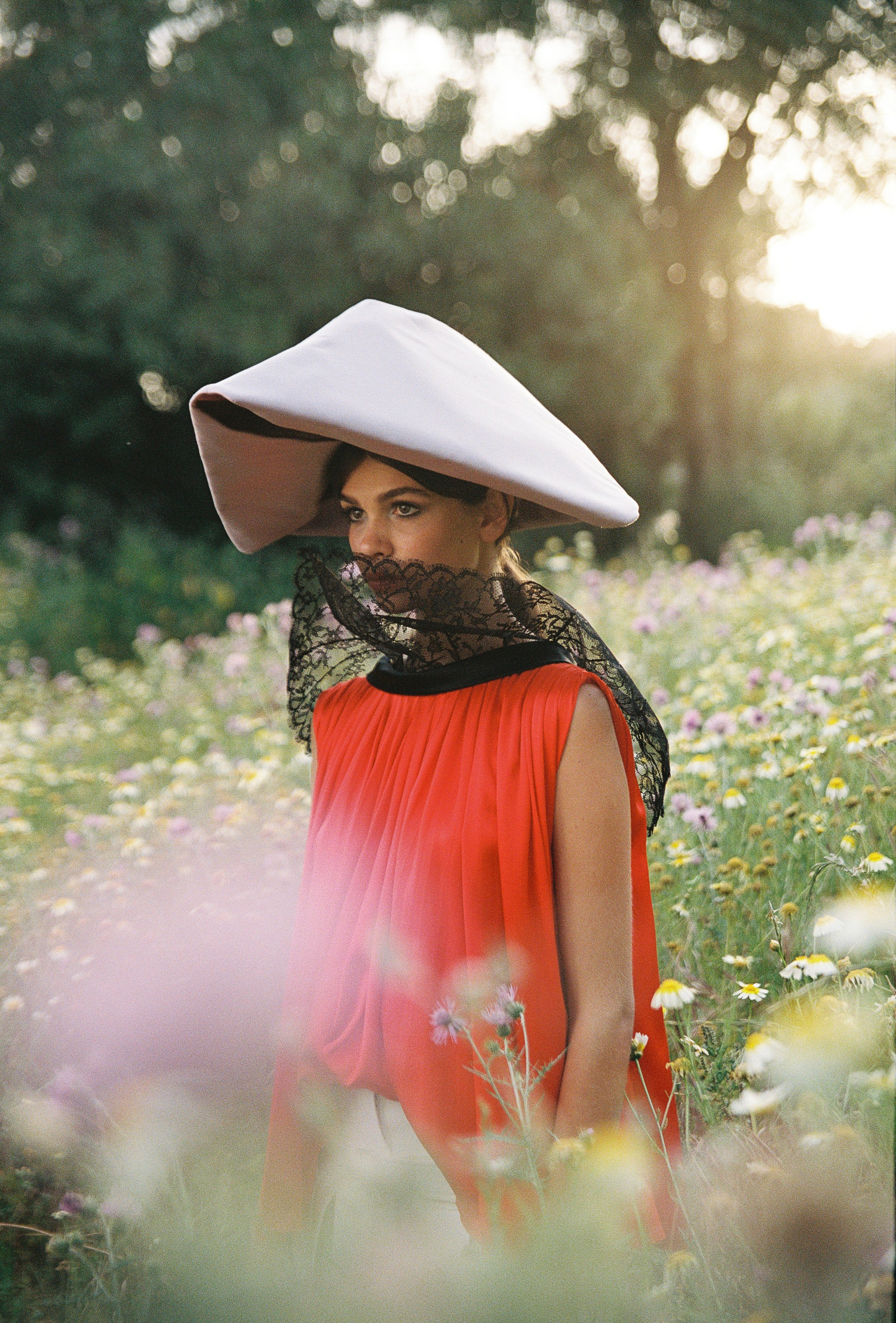 model wearing dior hat and shirt in a garden in palacio do grilo in Lisbon