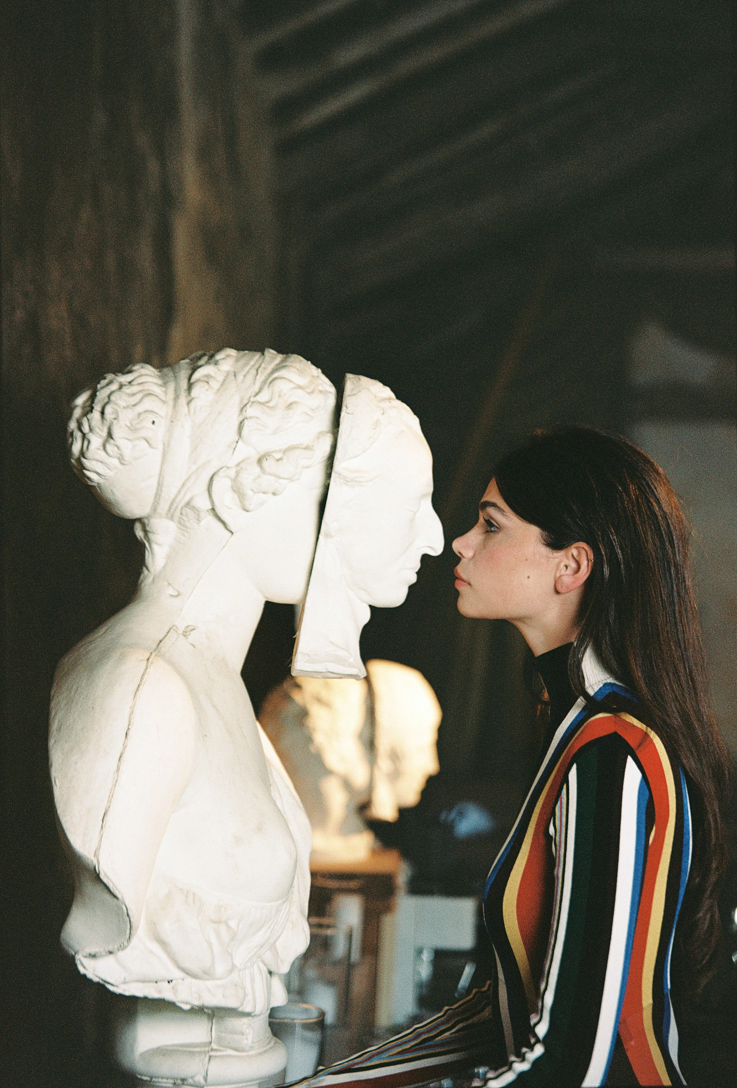 Model wearing a coloufull dress loewe at Palácio do Grilo in Lisbon.