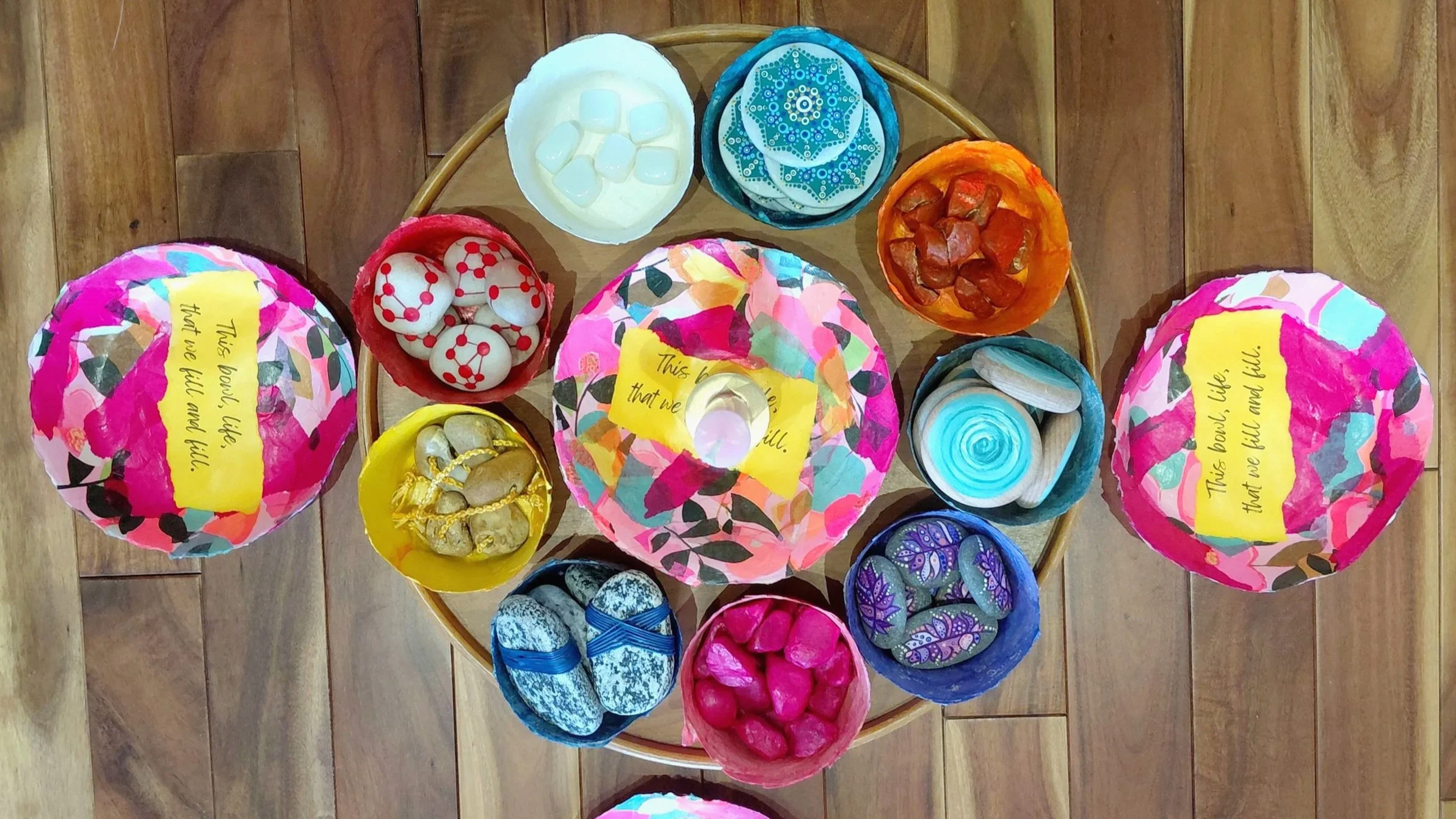 Bowls of colourful stones for a ceremony