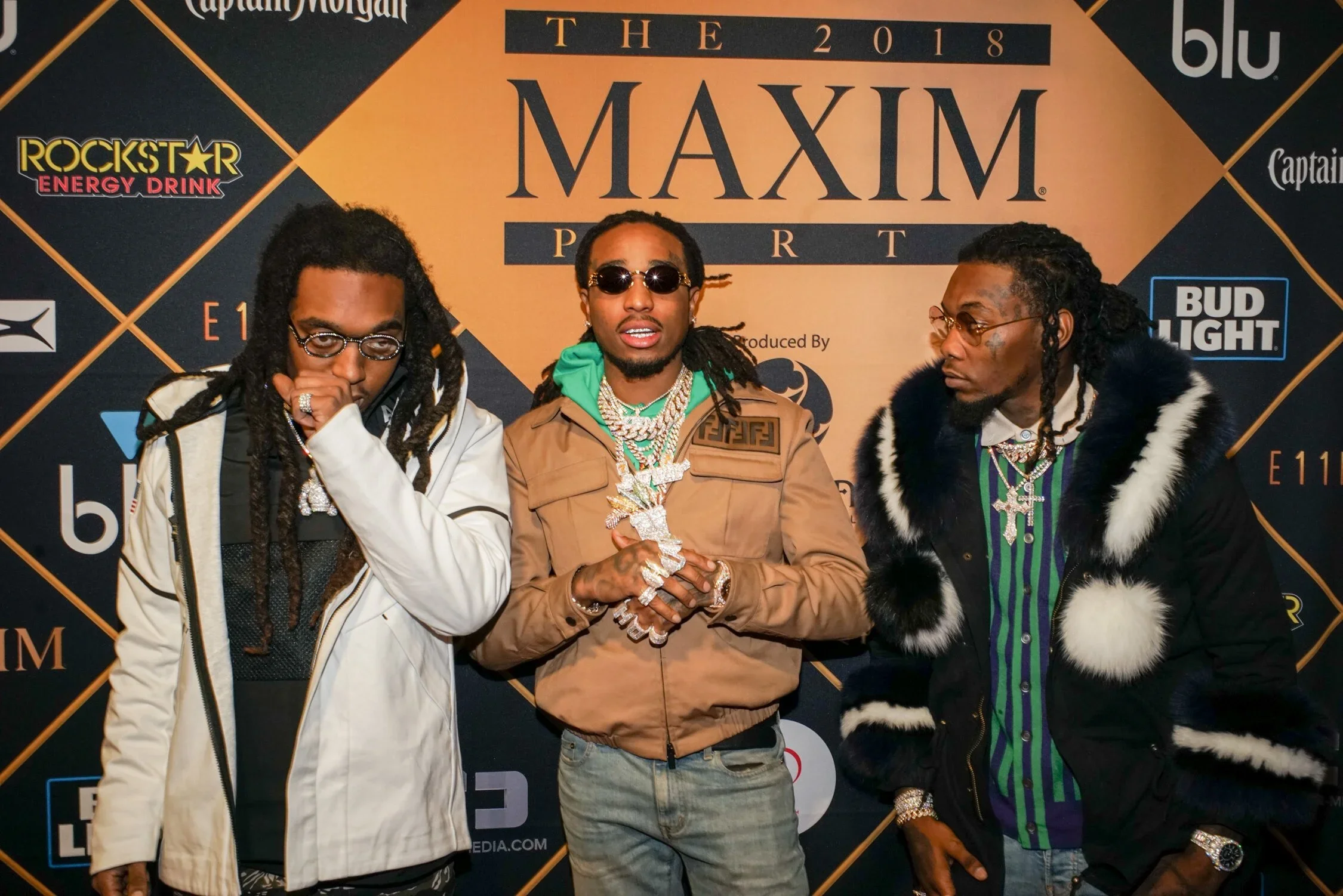 Migos (Quavo, Takeoff, and Offset) posing at the 2018 Maxim Party during Super Bowl LII in Minneapolis; red carpet celebrity photography by Lenny Kats, featuring luxury streetwear and heavy jewelry