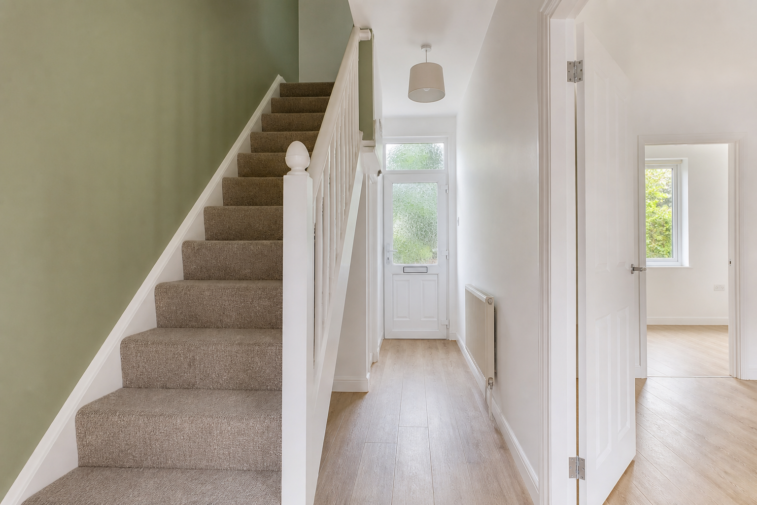 Clean, freshly refurbished entrance hallway and staircase in a Merseyside rental property
