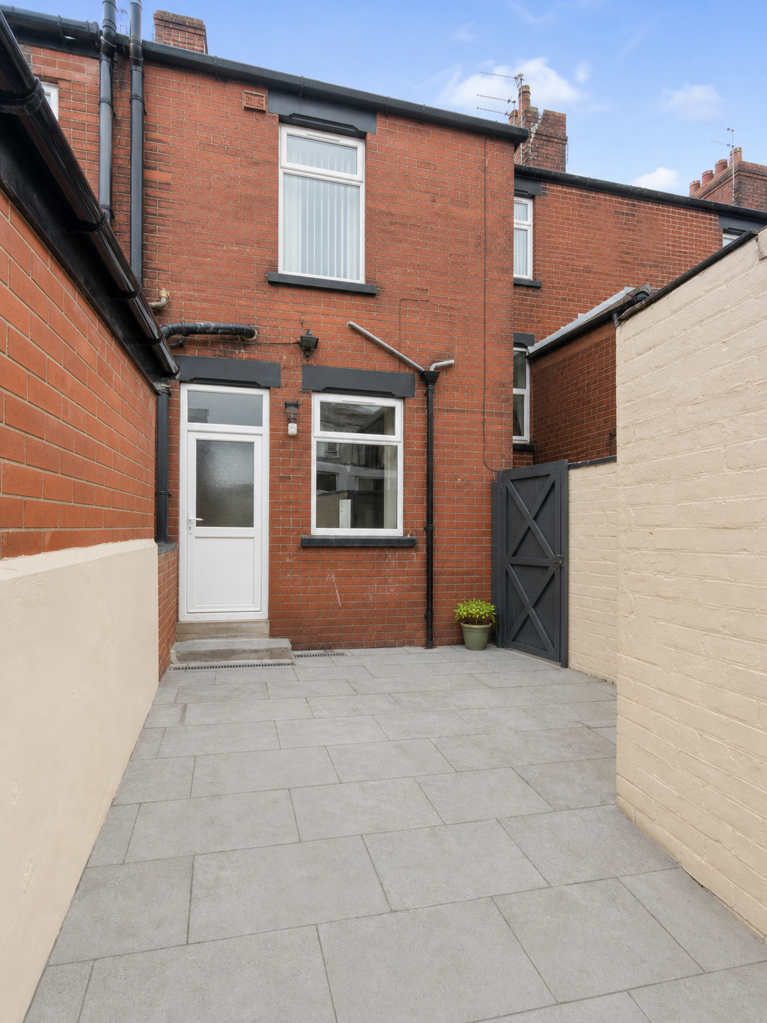 Freshly cleared and professionally cleaned rear yard at a Liverpool terraced rental property