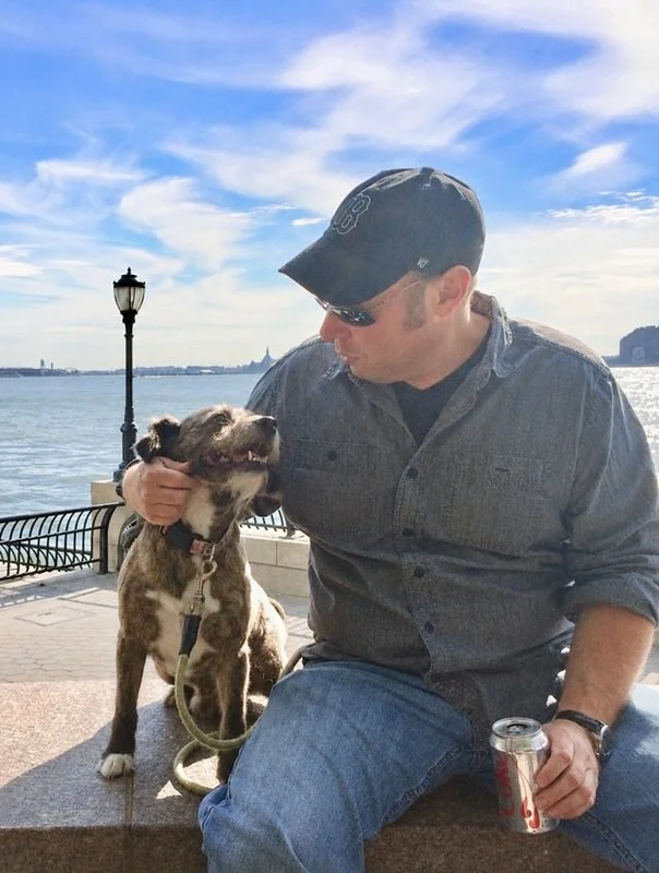 Andy and his dog Marley Goose sitting and looking at each other
