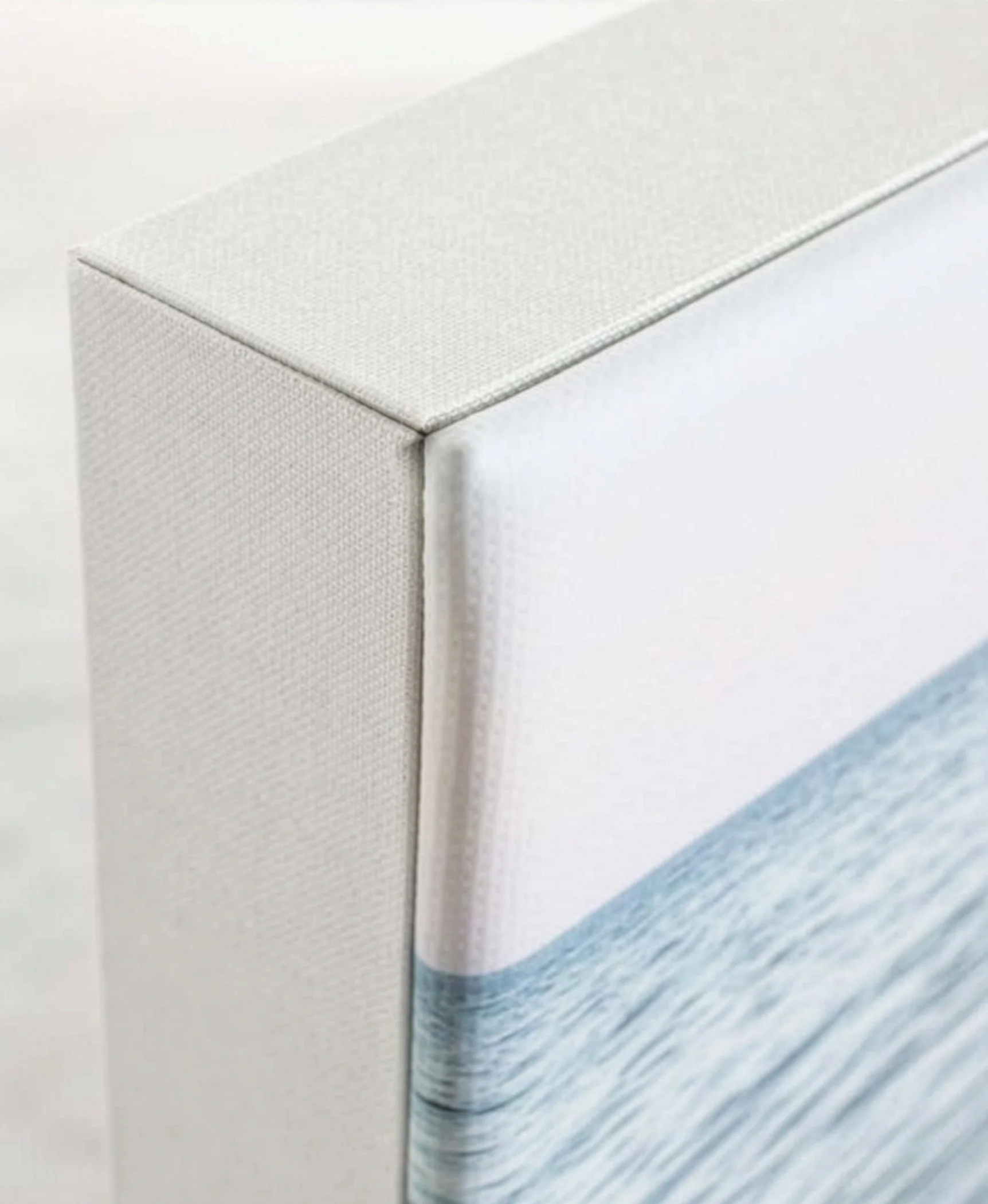 Close-up of the corner of canvas wall art — premium fine art albums by The Oak Studio