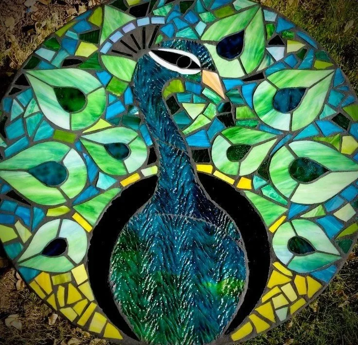 Glass mosaic tabletop featuring a blue and green peacock. 26" circle. Email for price.