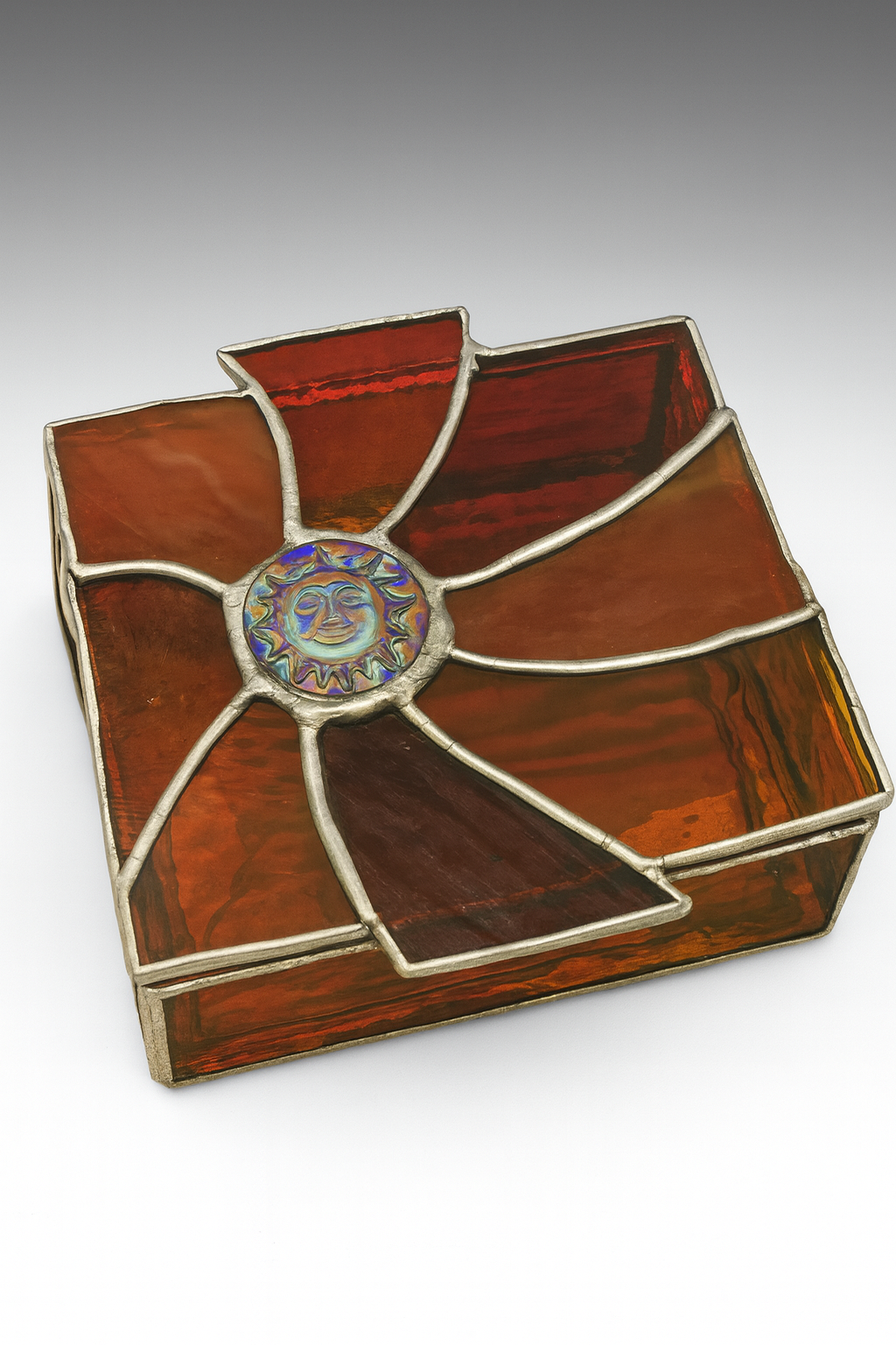 Red sunburst stained glass jewelry box with a hinged lid