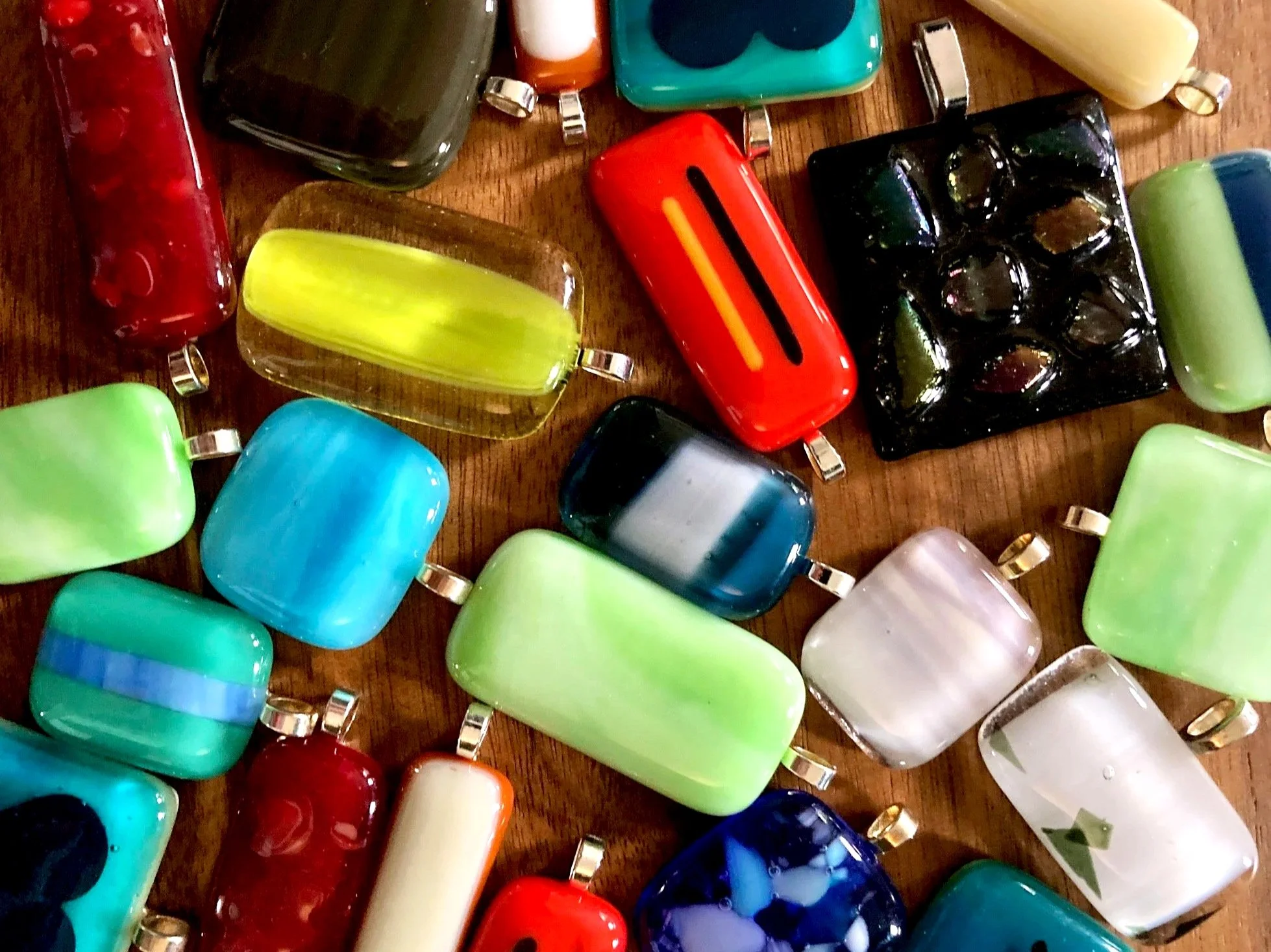 Fused glass pendant assortment in a variety of bright colors