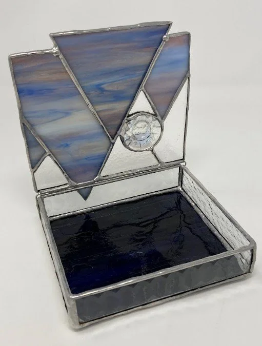 Stained glass trinket keepsake box featuring a mountain landscape lid. Opens with hinge. 5 x 5 x 1 inch. $95.