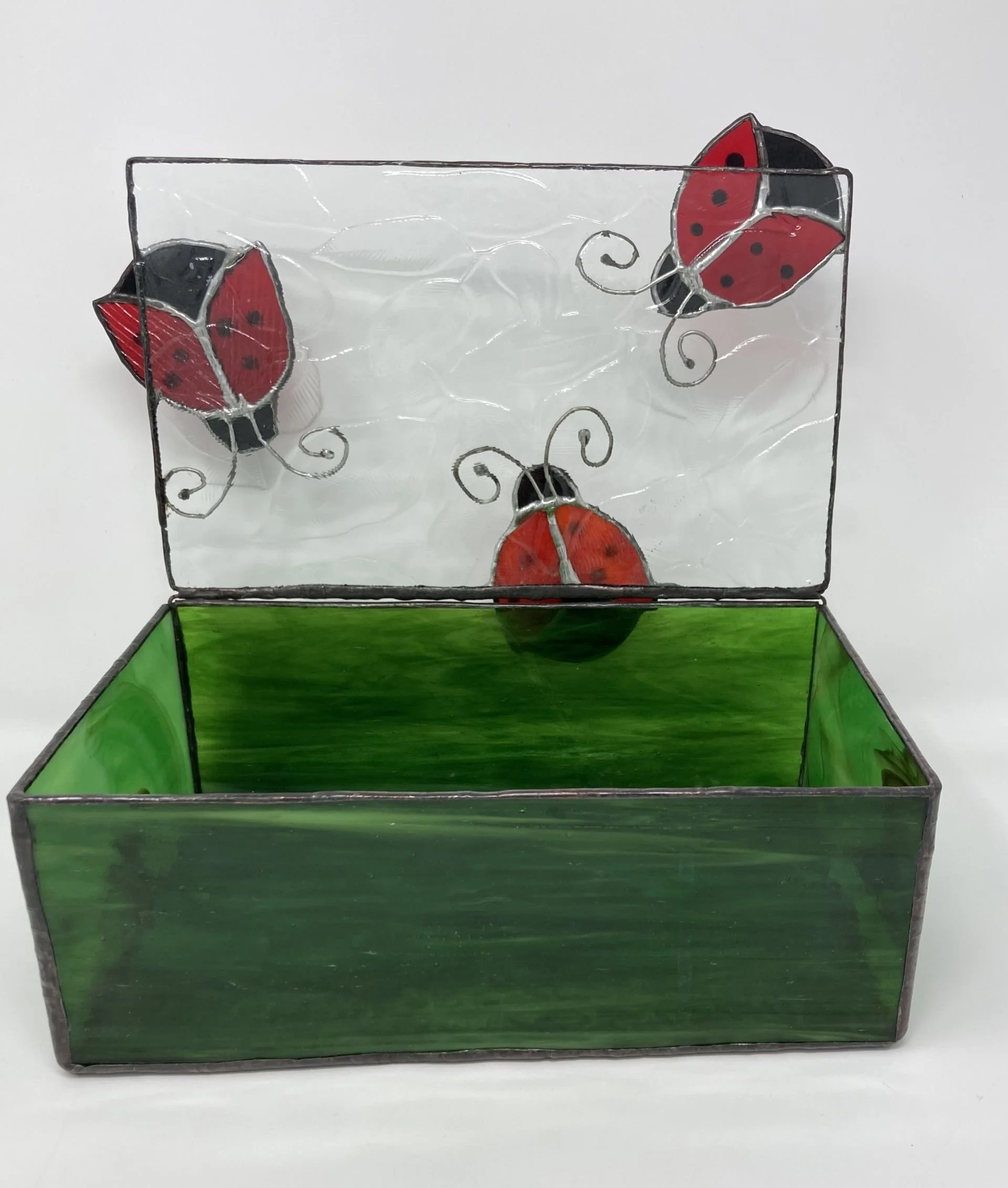 Green stained glass jewelry box with three red ladybugs on lid. 10 x 5 x 5 inch. $240.