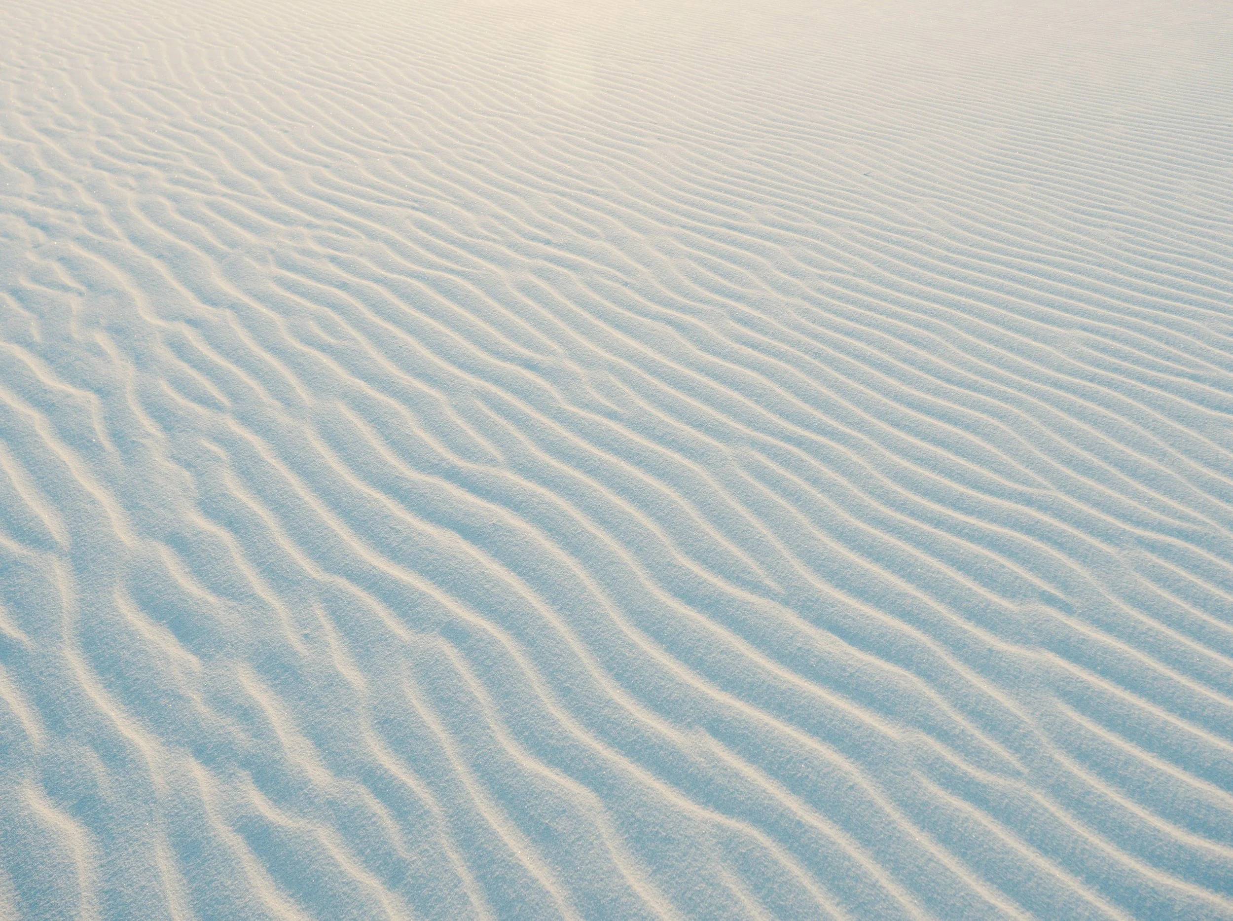 photo of sand dunes with gentle wave patterns