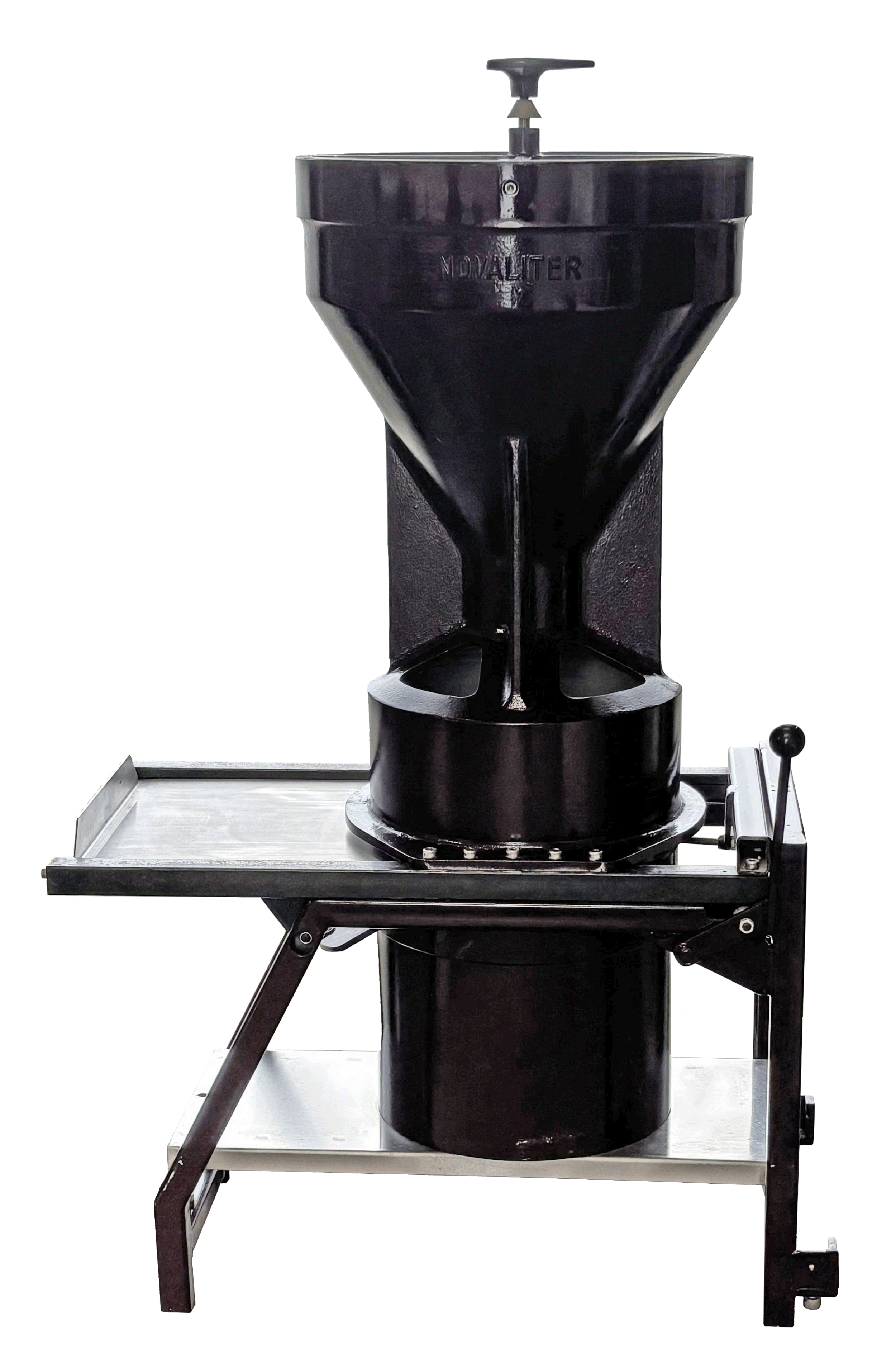 A large black industrial milling machine with a black control handle, mounted on a metallic support table with a white surface and black legs.