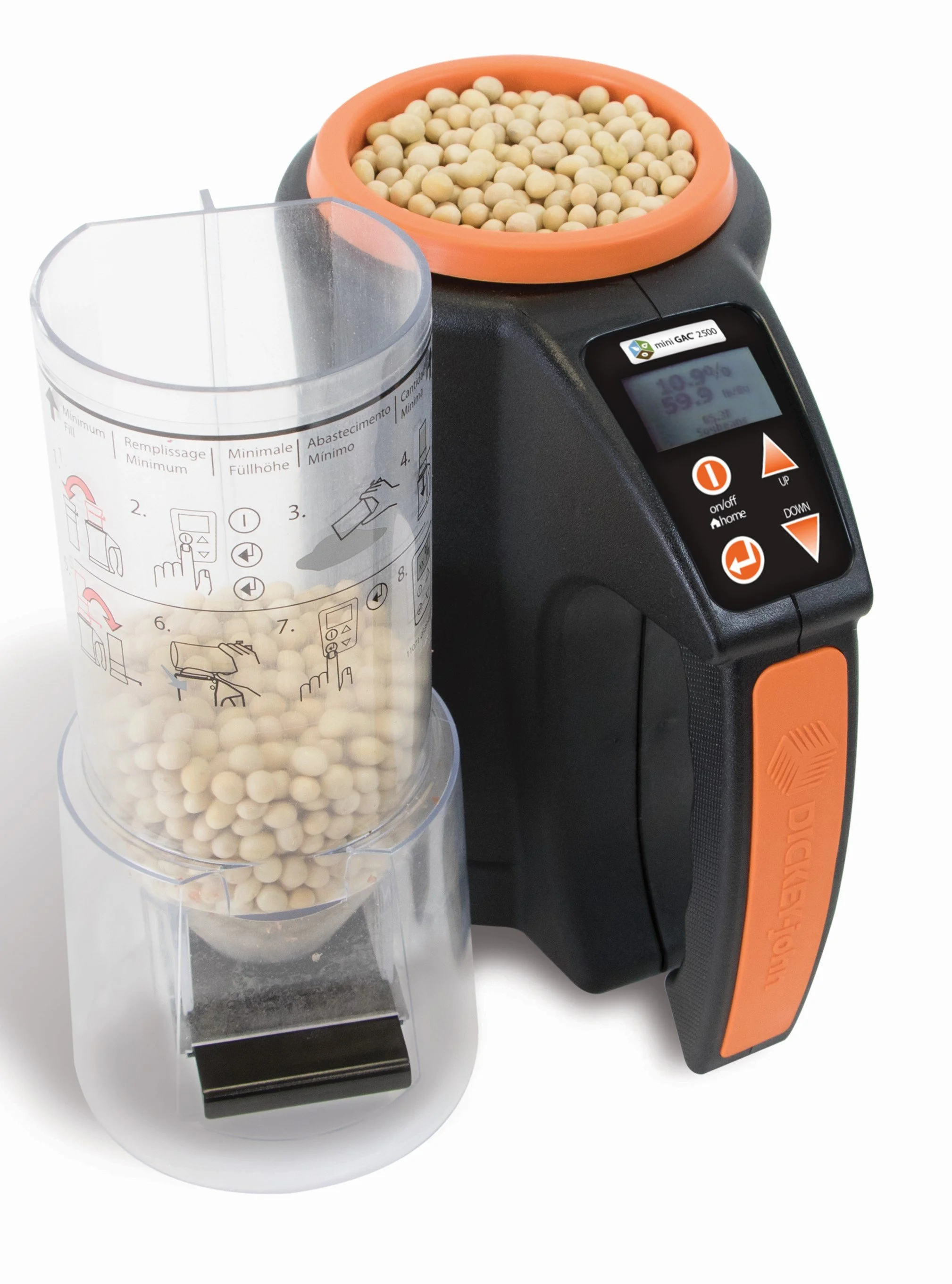 A digital laboratory device with an orange and black body, displaying a screen with some data, and a transparent container filled with small white spherical objects, possibly beads or pellets, connected to the device.