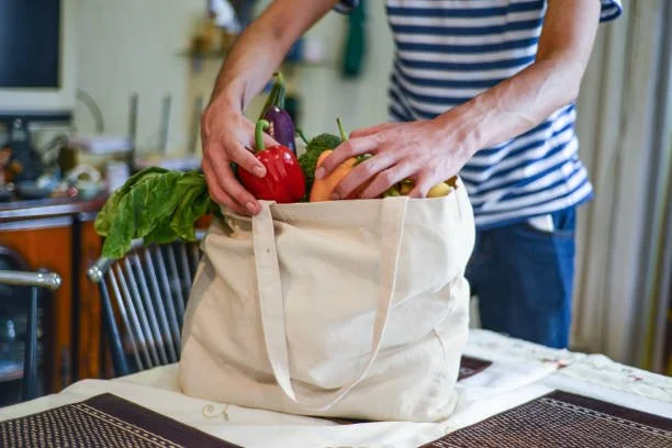 Person unpacked shopping bag from grocery food store