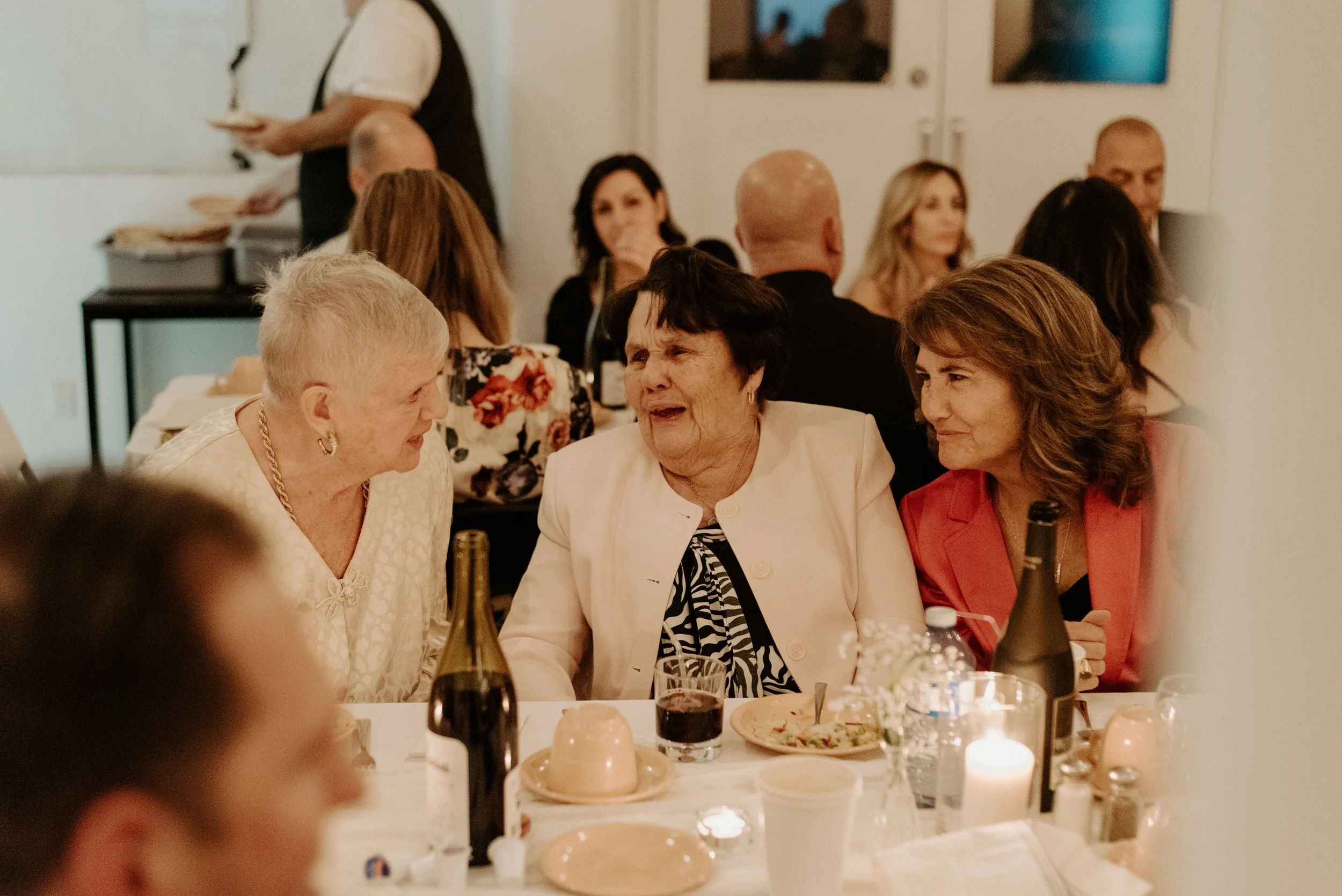 Wedding Guests socialize and laugh at this Montreal Wedding reception.