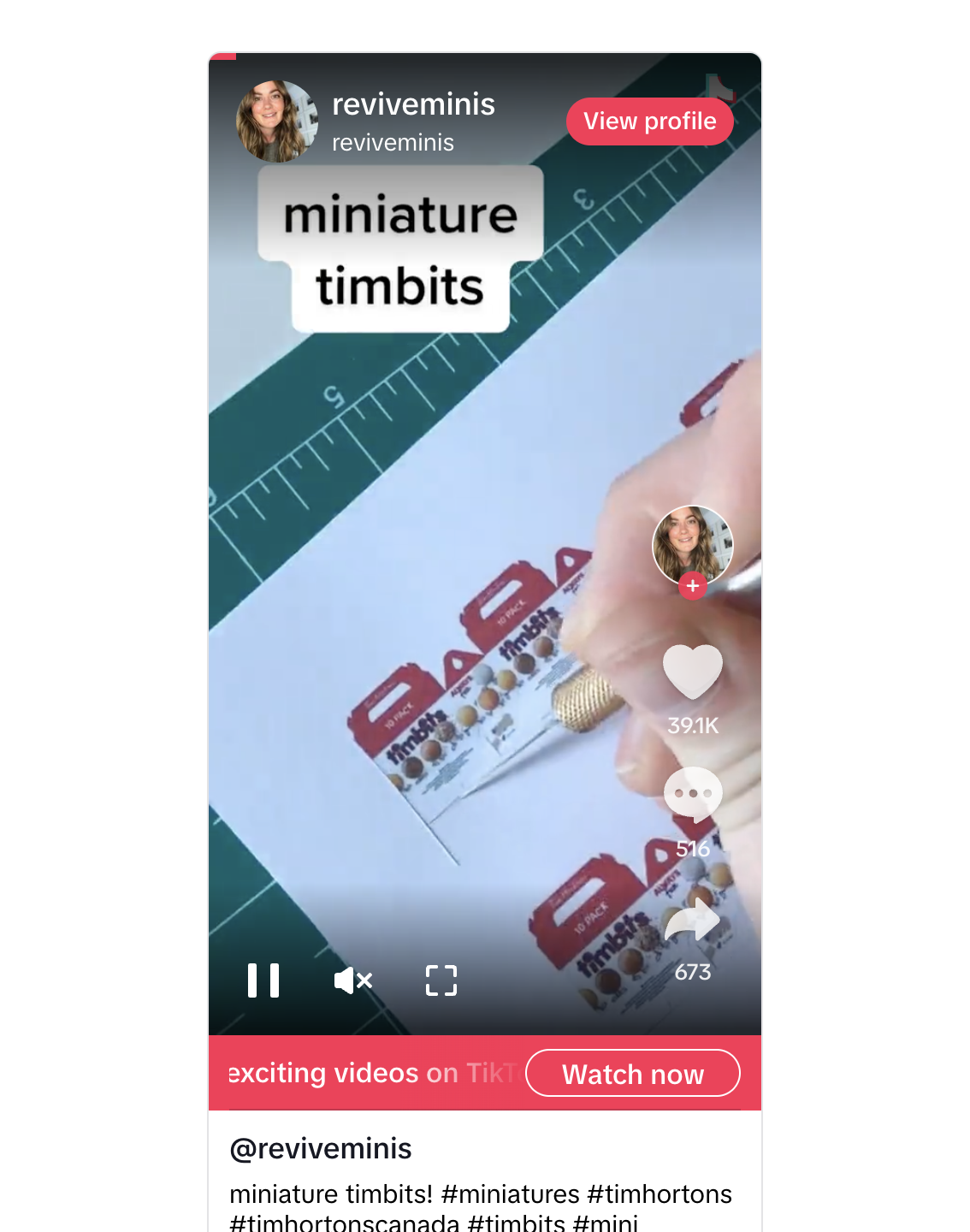 A person is writing on a paper with a small Tim Hortons Timbits box visible in the background. A measuring ruler is positioned on the paper, indicating the small size of the Timbits.
