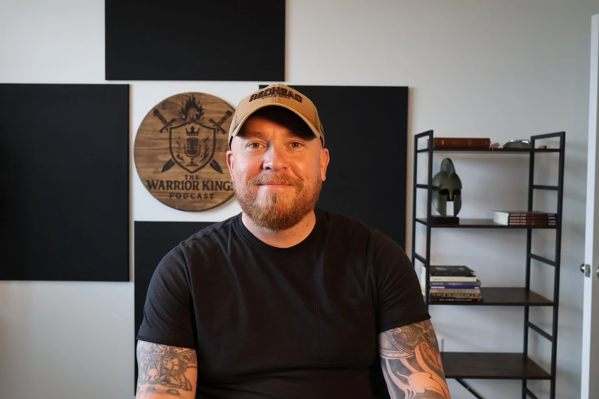 Michael Riggs, host of The Warrior Kings Podcast and men's marriage coach, smiling in his studio