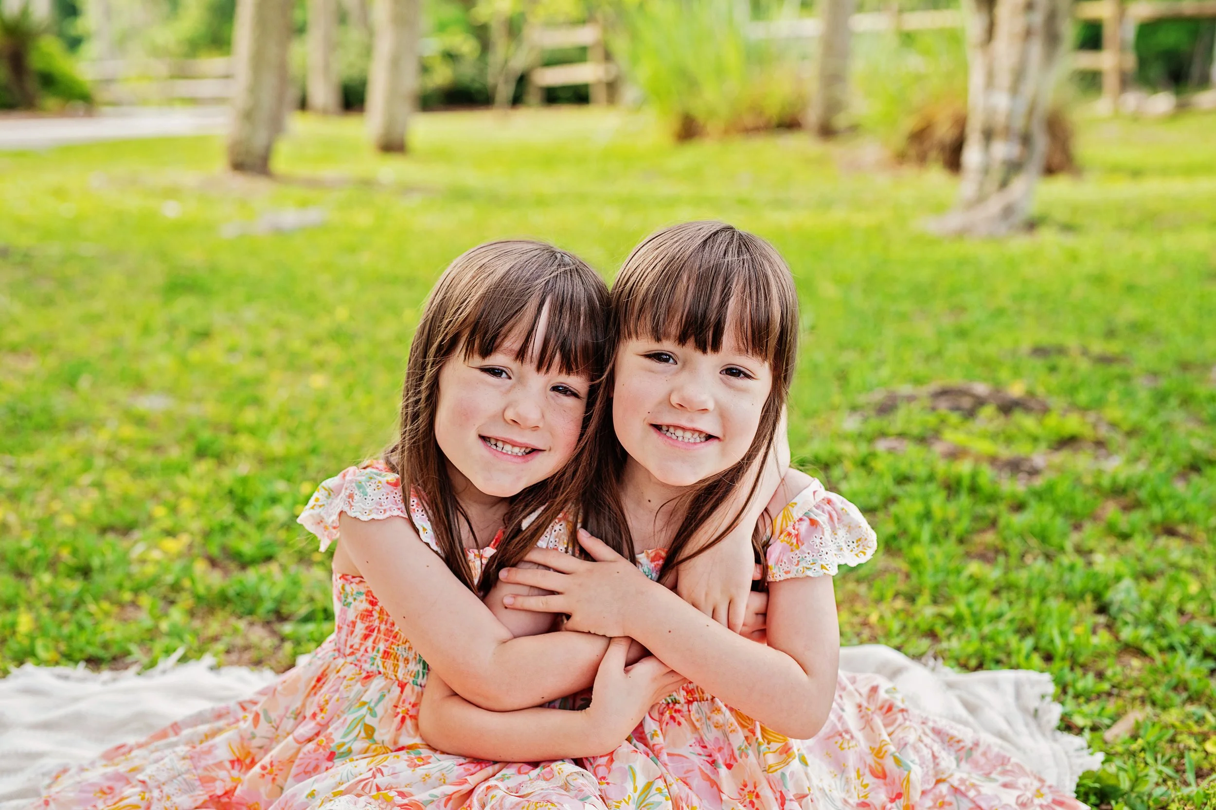 Twin girls pose for family photos in Silver Springs state park Florida