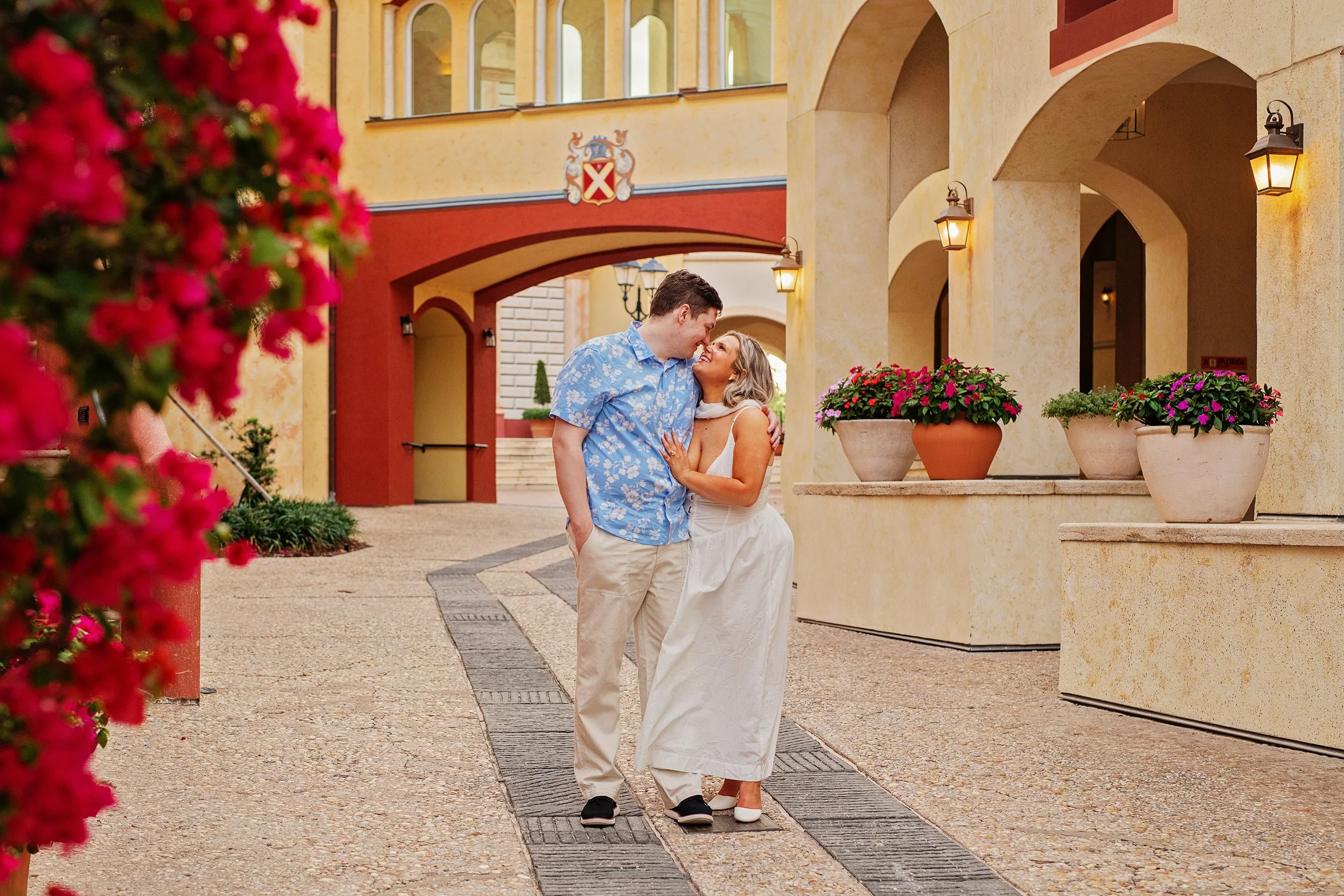 Couple posing for engagment photos at Universal's Portofino Bay resort
