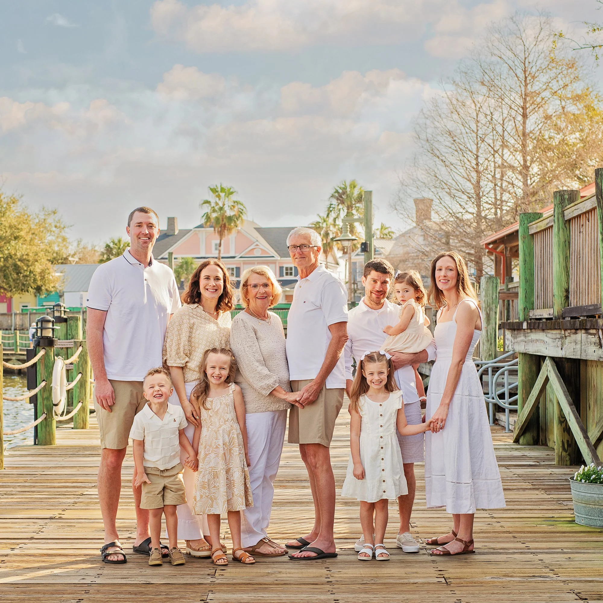 Extended family session, posing for a photoshoot on the boardwalk at the The Villages Sumter Landing
