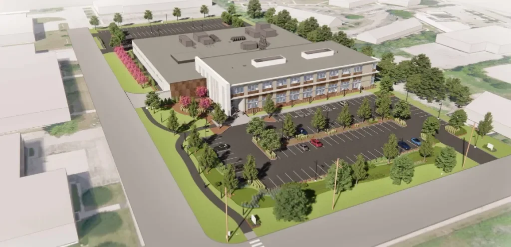 A 3D rendering of a modern multi-story building with a parking lot, green landscaping, and trees surrounding the area.