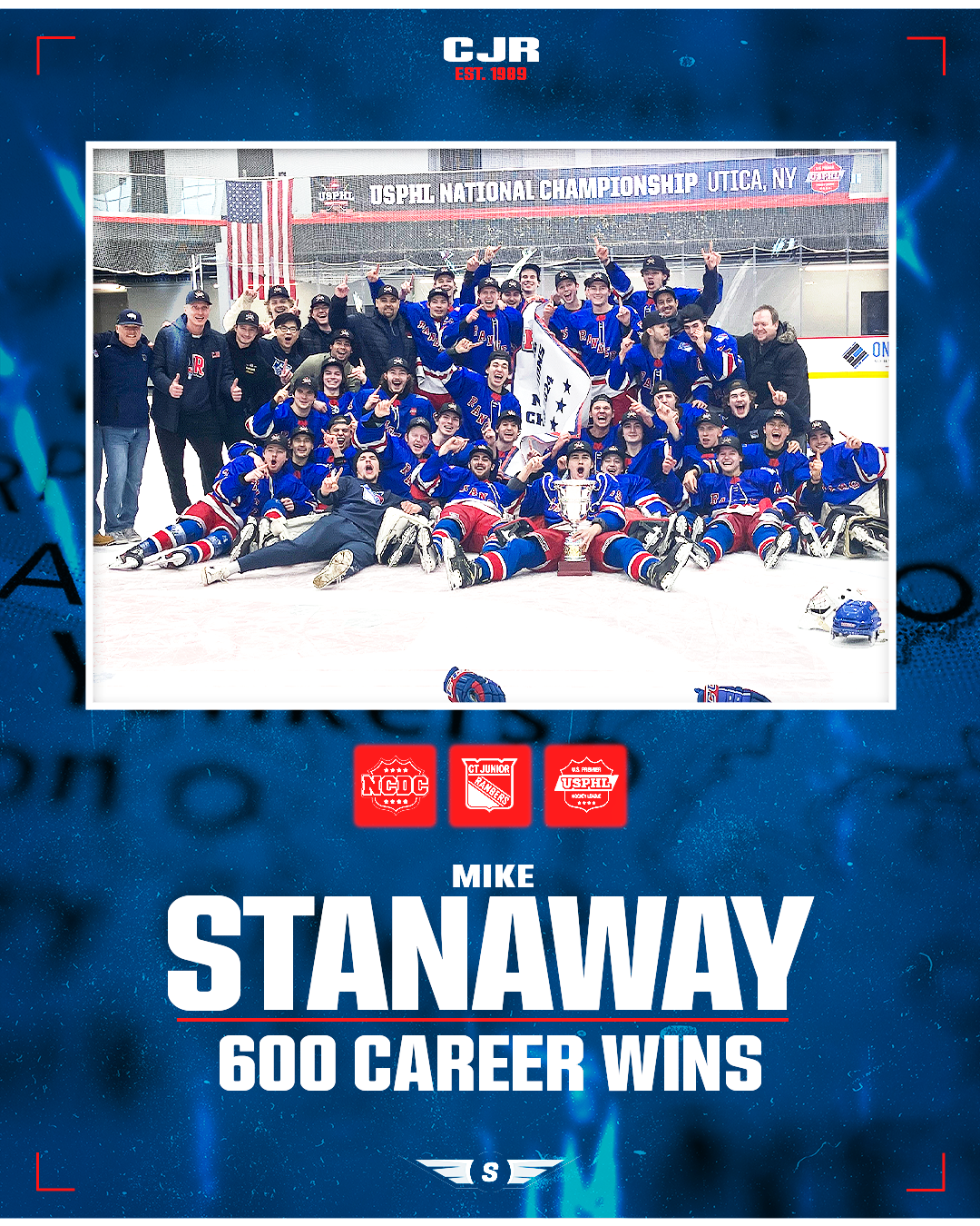 Celebrating hockey team with players and coaches, holding a trophy, with a banner reading 'USPHL National Championship' in the background, commemorating Mike Stanaway's 600 career wins.