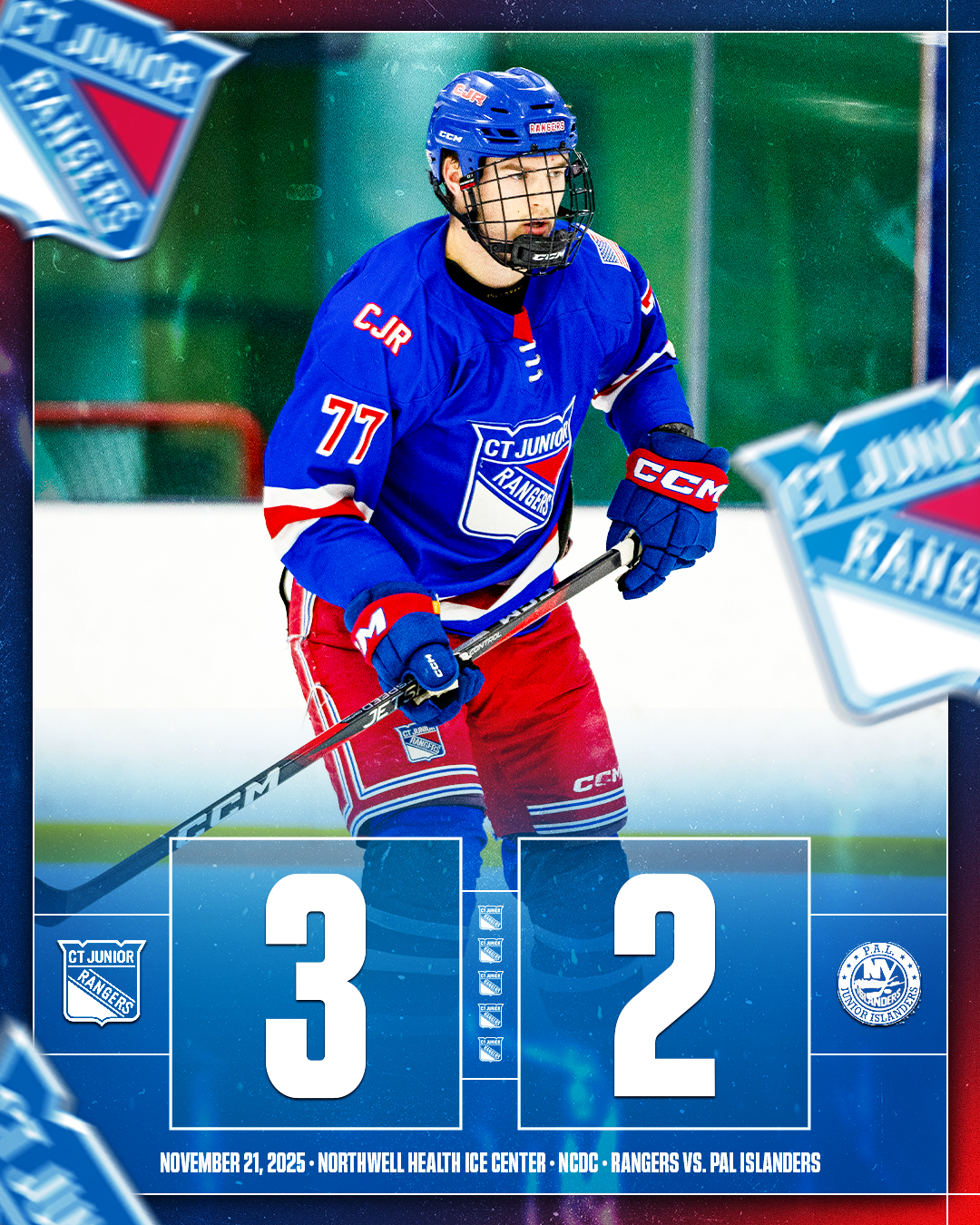 Ice hockey player wearing a blue jersey and red shorts, holding a hockey stick, on the ice rink, celebrating a win with score 3 to 2 between CT Junior Rangers and PAL Islanders, on November 21, 2025 at Northwell Health Ice Center.