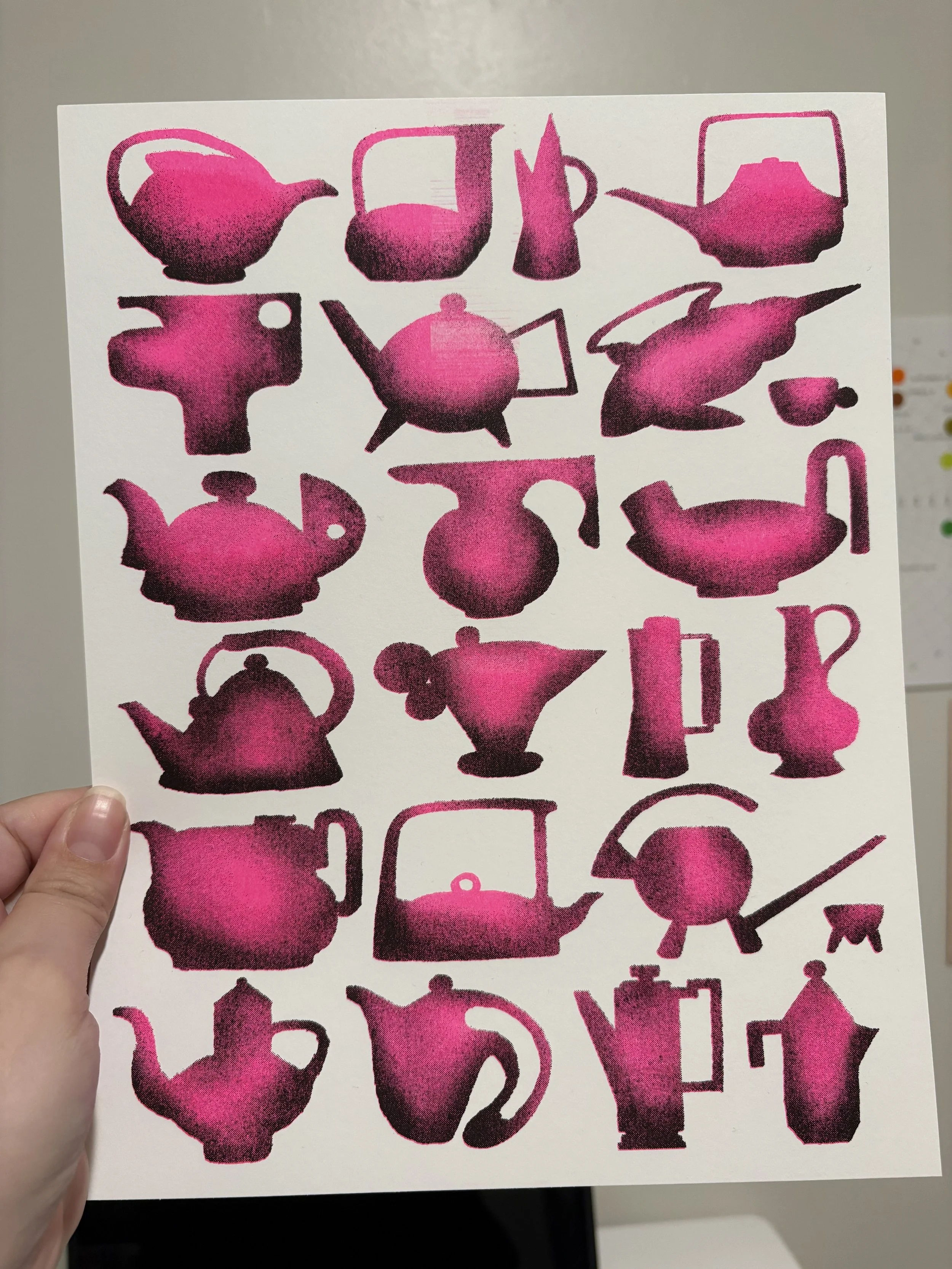 A sheet of paper featuring silhouettes of various teapots, cups, and related teapot icons, risograph printed using fluorescent pink and black inks