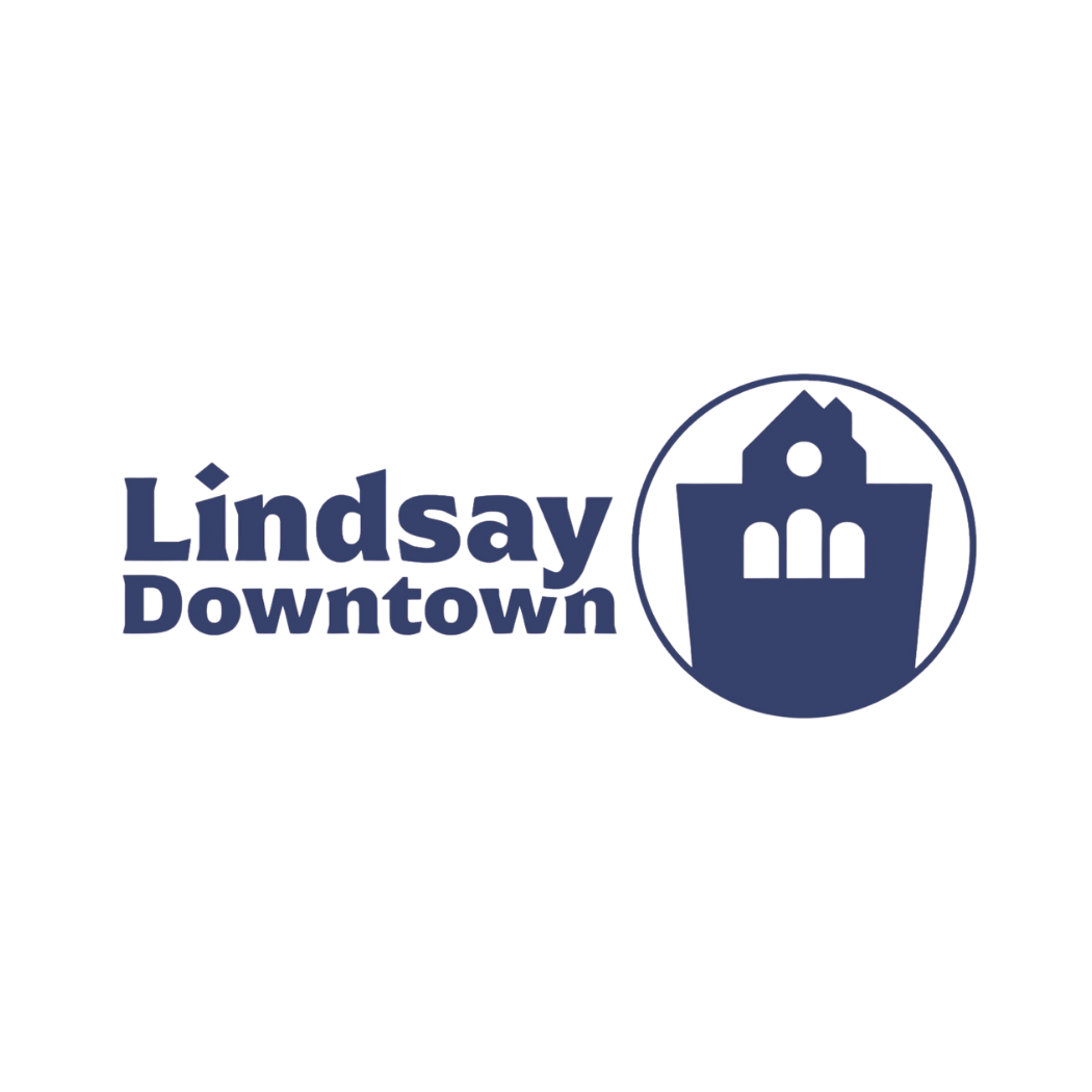 Logo for Lindsay Downtown with a stylized city building icon in a circle and text in bold blue font.