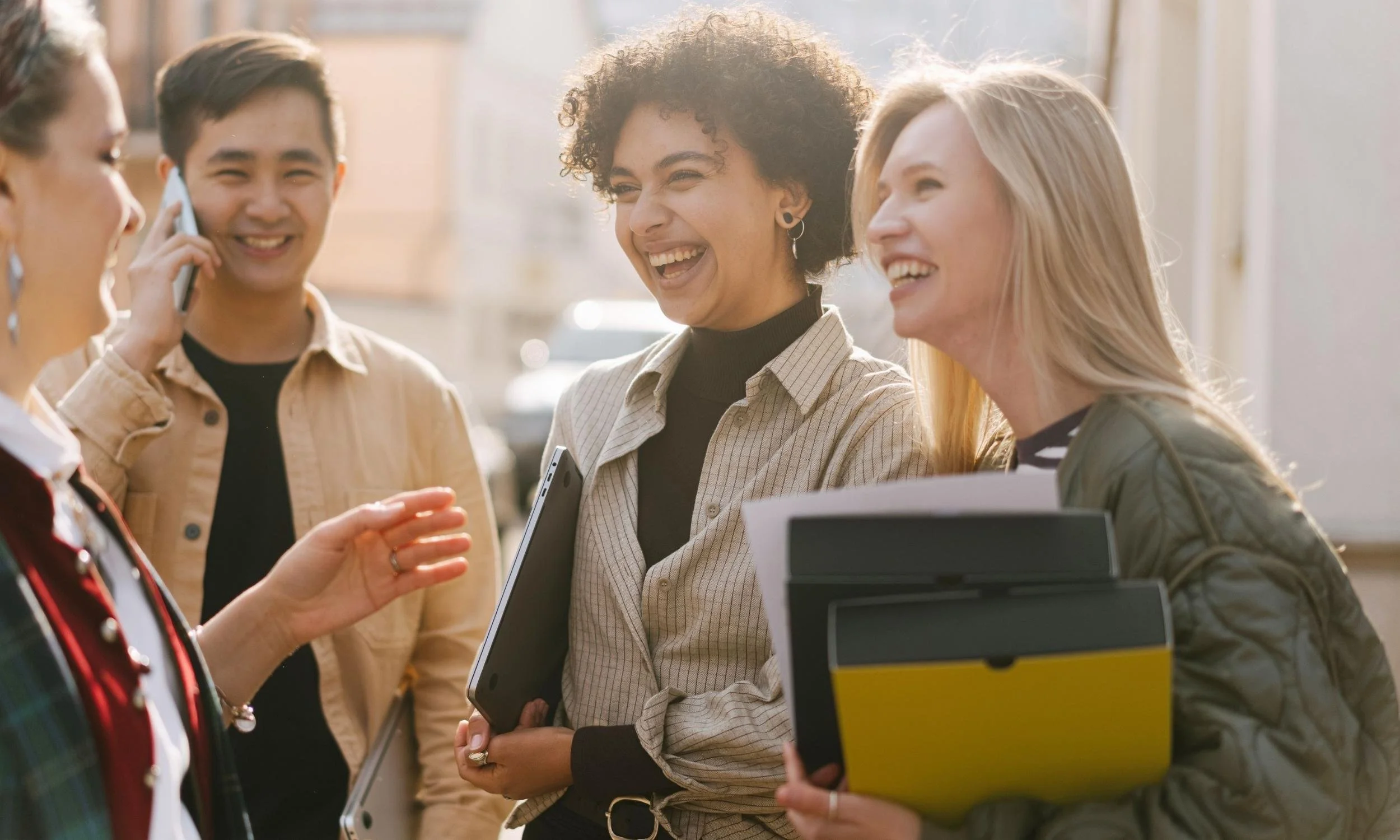 Diverse students networking and celebrating academic success through a non profit organisation in Elmhurst, IL committed to leadership development and educational excellence.