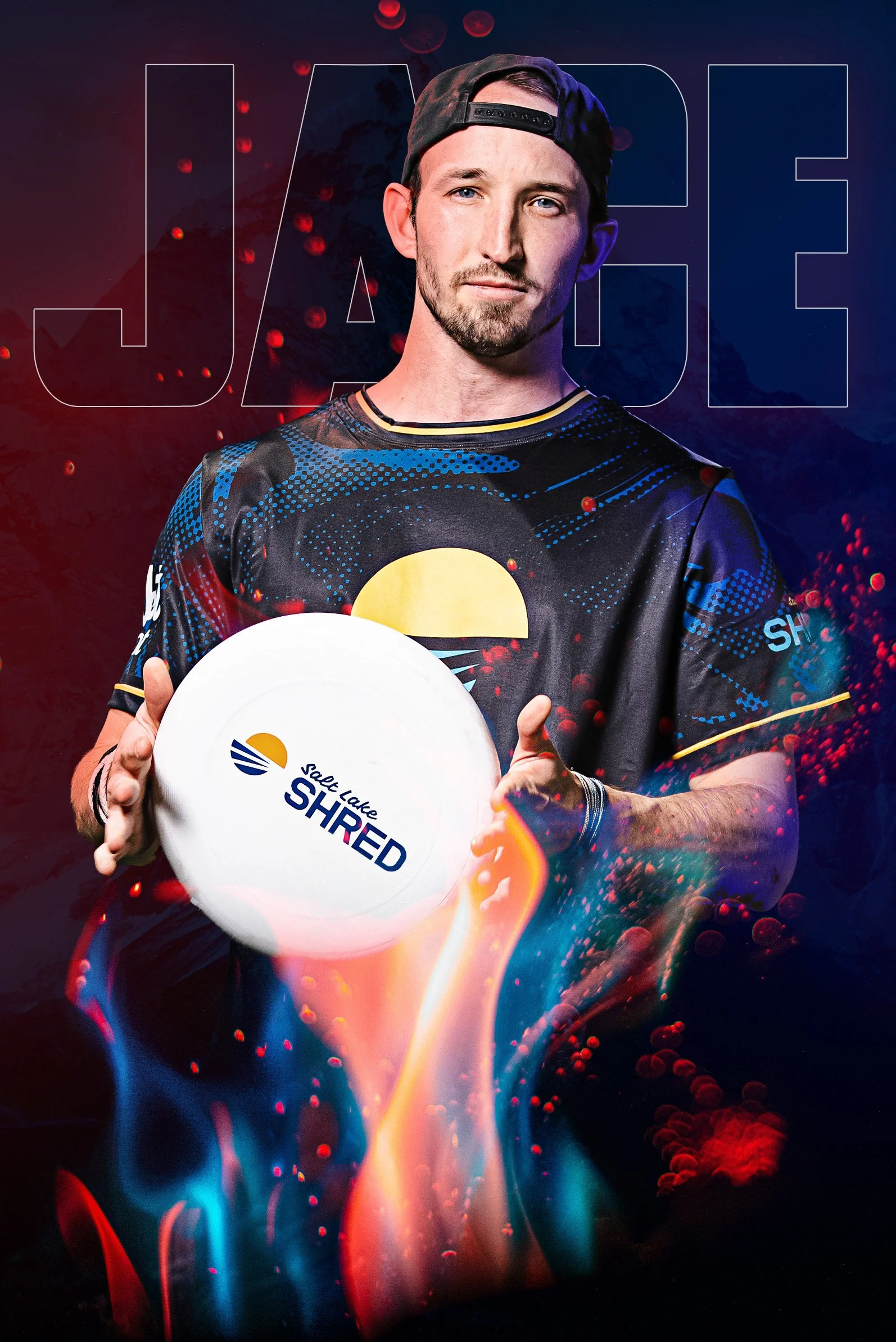 A young man wearing a black cap backwards and a black sports jersey with blue and yellow accents, holding a frisbee with the logo for Salt Lake Shred. The background features a mountain and an abstract, colorful, swirling design with red, blue, and yellow accents.