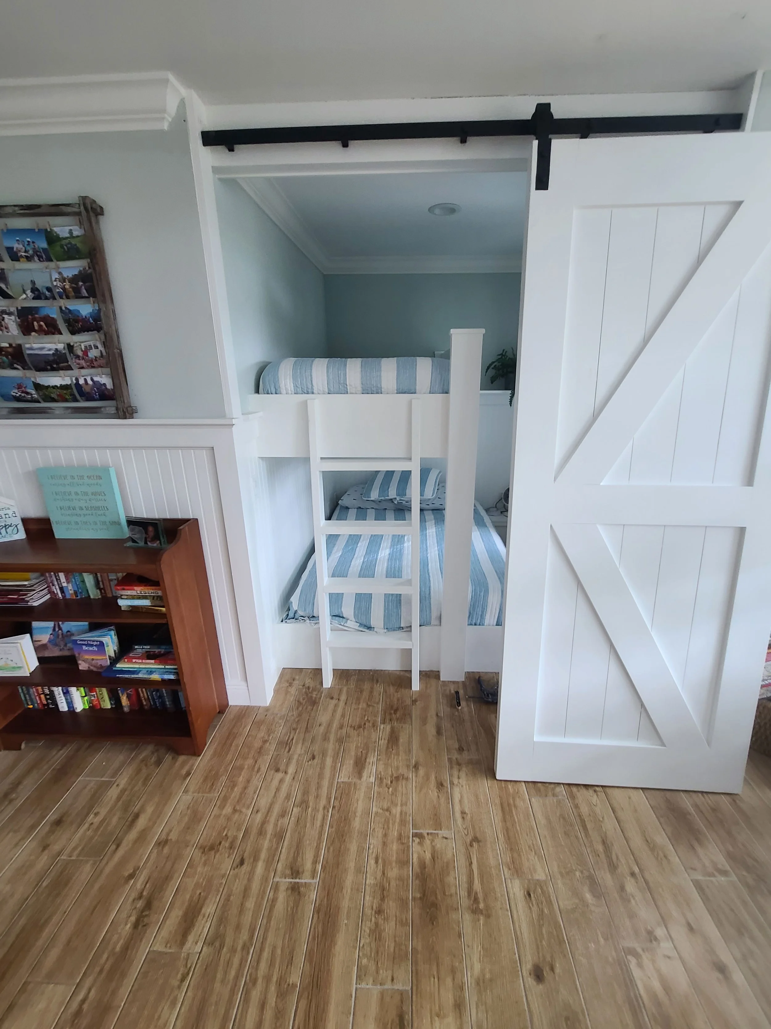 White sliding barn door and interior storage — Project 03.