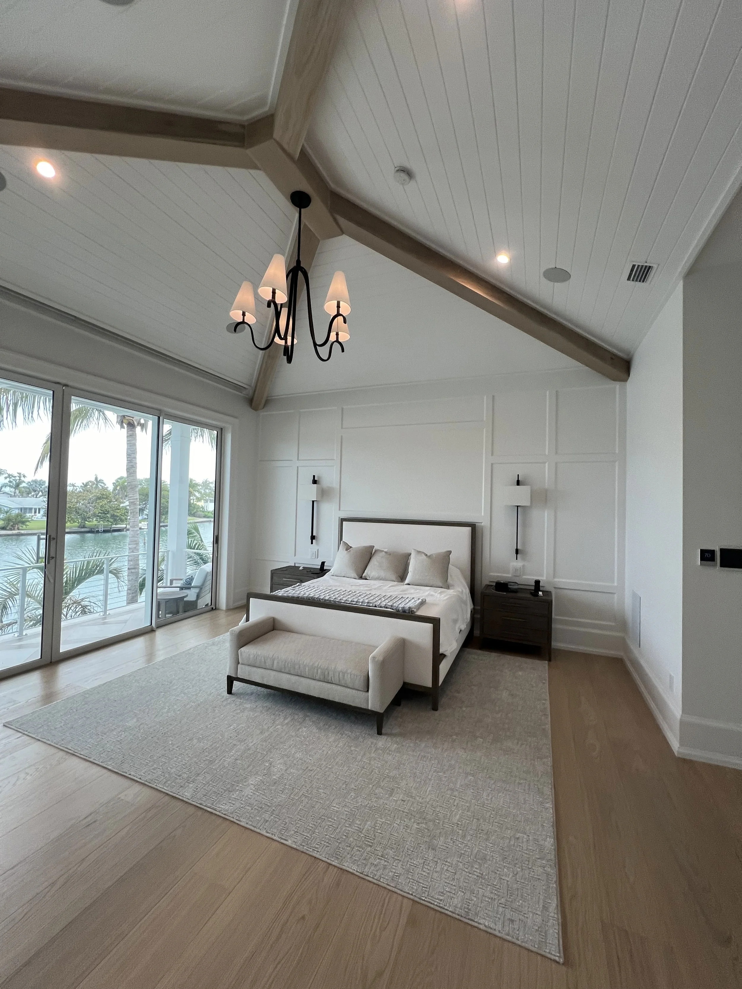 Exposed wood beams and planked vaulted bedroom ceiling — Project 06.